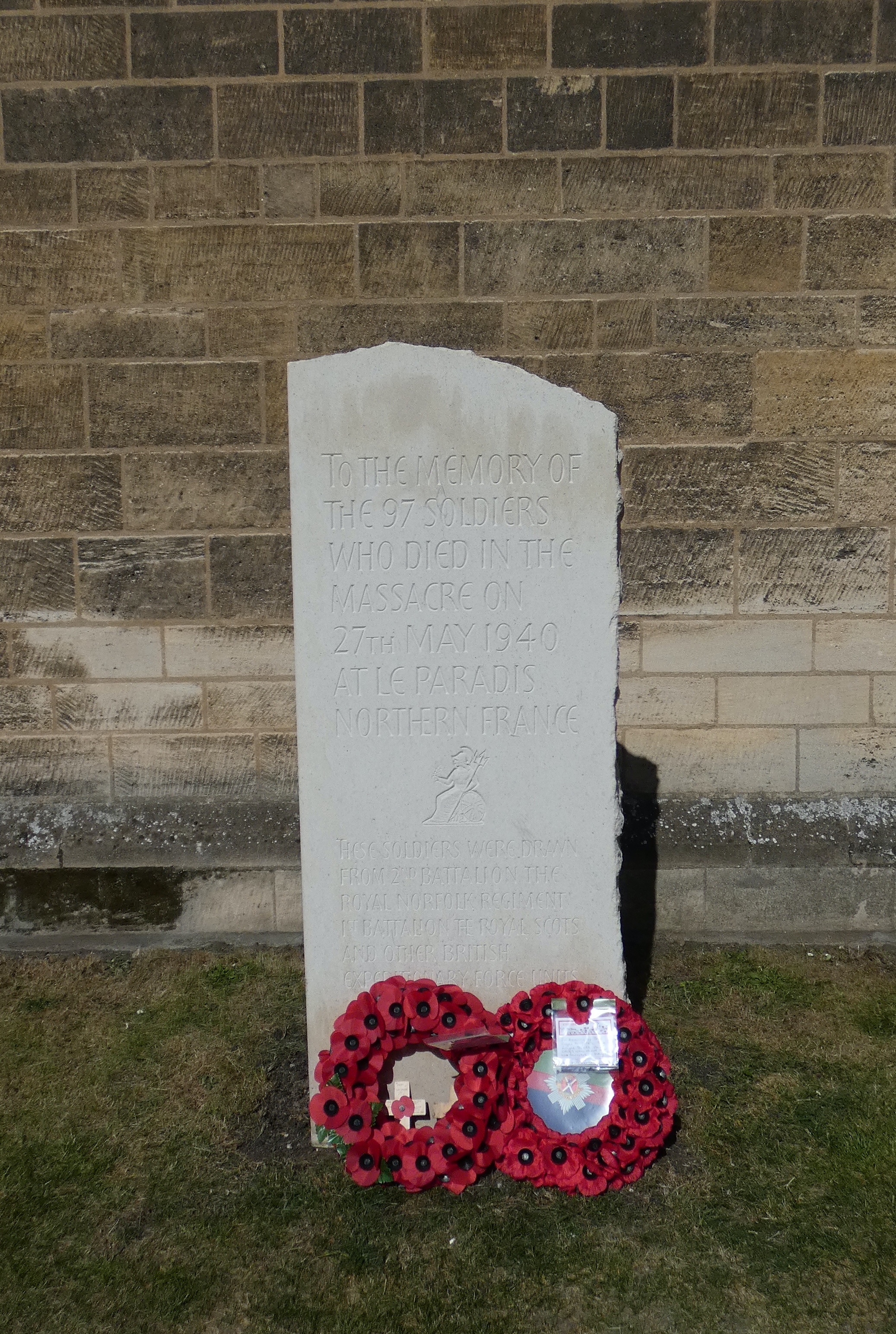 The memorial was dedicated on 13 July 2021 by HRH The Princess Royal.[1] Inscription reads: 'to the memory of the 97 soldiers who died in the massacre on 27th May 1940 at Le Paradis, Northern France [badge of the Royal Norfolk Regiment] These soldiers were drawn from the 2nd Battalion The Royal Norfolk Regiment, 1st Battalion The Royal Scots and other British Expeditionary Force units'.