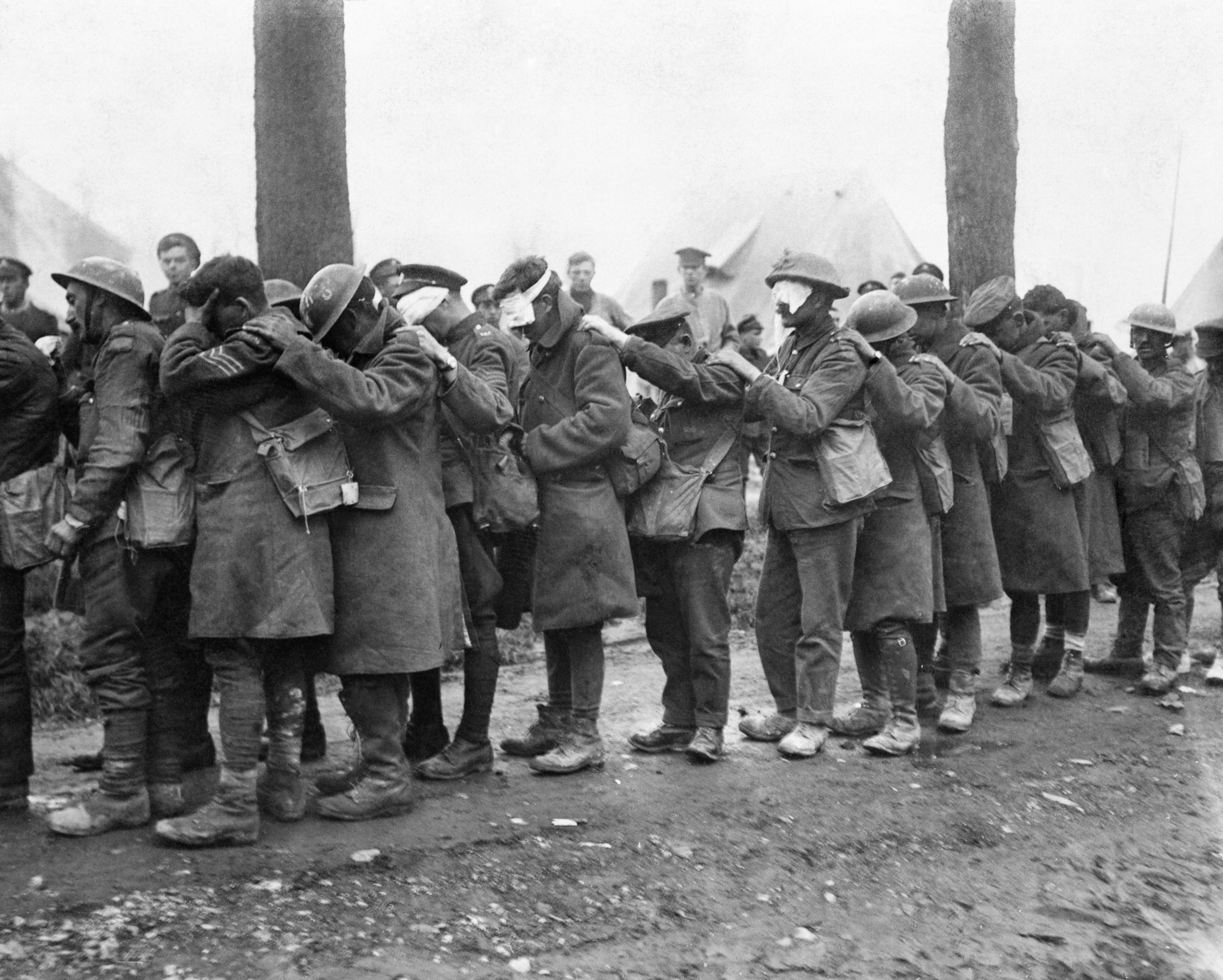British 55th (West Lancashire) Division troops blinded by tear gas await treatment at an Advanced Dressing Station near Bethune during the Battle of Estaires, 10 April 1918, part of the German offensive in Flanders.