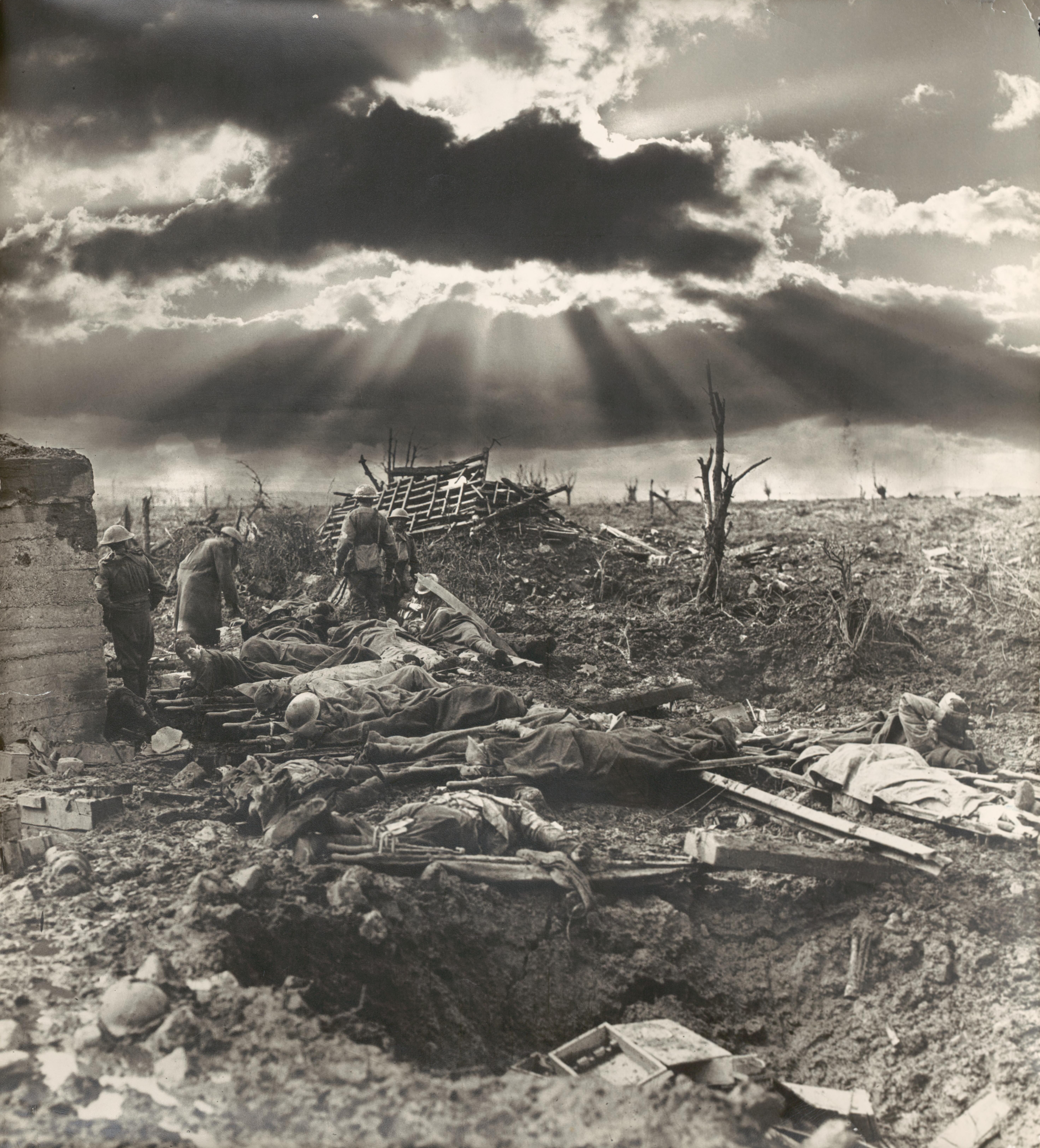 [The morning after the first battle of Paschendaele [Paschendale], Australian Infantry wounded around a blockhouse near the site of Zonnebeke Railway Station,12 October 1917
1 negative : glass ; full plate. 

According to Robert Dixon this is a composite image, one of four versions with different "sunburst" formations in the clouds created from originally separate negatives. See also File:Morning a Passchendaele. Frank Hurley (glass negative).jpg. This photograph was part of an exhibition of Hurley's photographs at The Kodak Salon, George Street, Sydney, in early 1919.[1]
