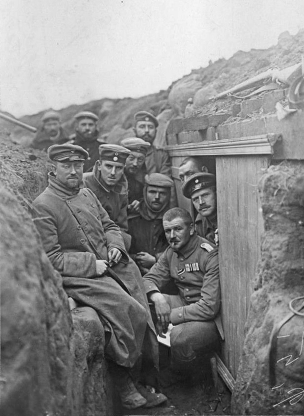 This is a photo of the German soldiers in a trench at Ypres, Belgium, 1914. The Battle of Ypres was during the First World War, in the general area of the Belgian city of Ypres, where the German and the Allied armies (Belgian, French, British Expeditionary Force and Canadian Expeditionary Force) clashed. There were hundreds of thousands of casualties. The term "Battle of Ypres" could mean all the fighting that occurred in that area. But the "Battle of Ypres" could refer more specifically to any one of five battles from the year 1914-1918.