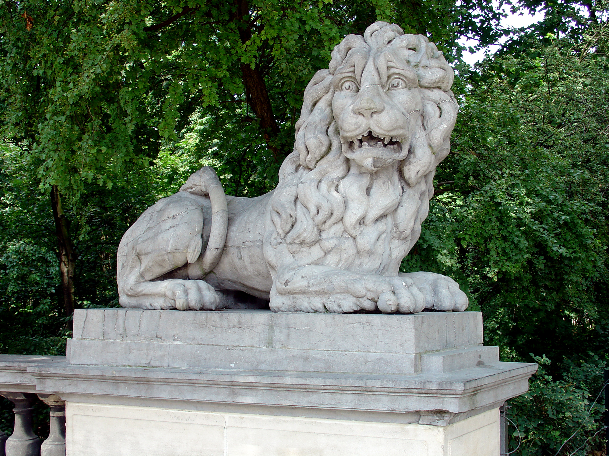 Statue of lion on park entrance near Royal Pallace in Brussels