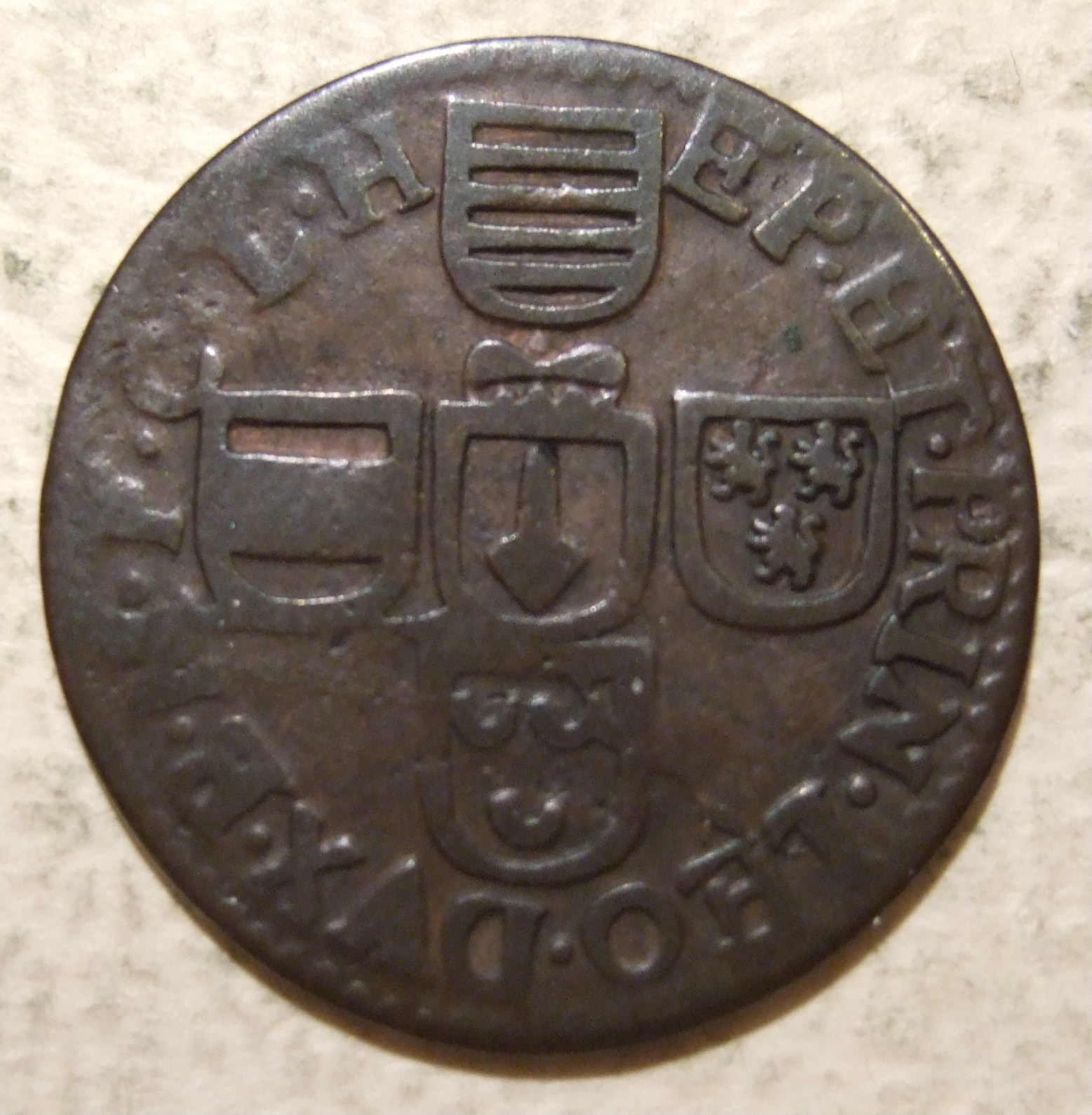 This quarter sized jeton may have been issued in Liège from 1744-63 during the reign of Johann Theodor of Bavaria. The legend reads THEODORVS on the revese side. On this side the legend reads PRIN-LEO-DVX (Principati Leodiensis Dux--Duke of the Principality of Liege), and the arms are those of the Prince-Bishopric of Liège.