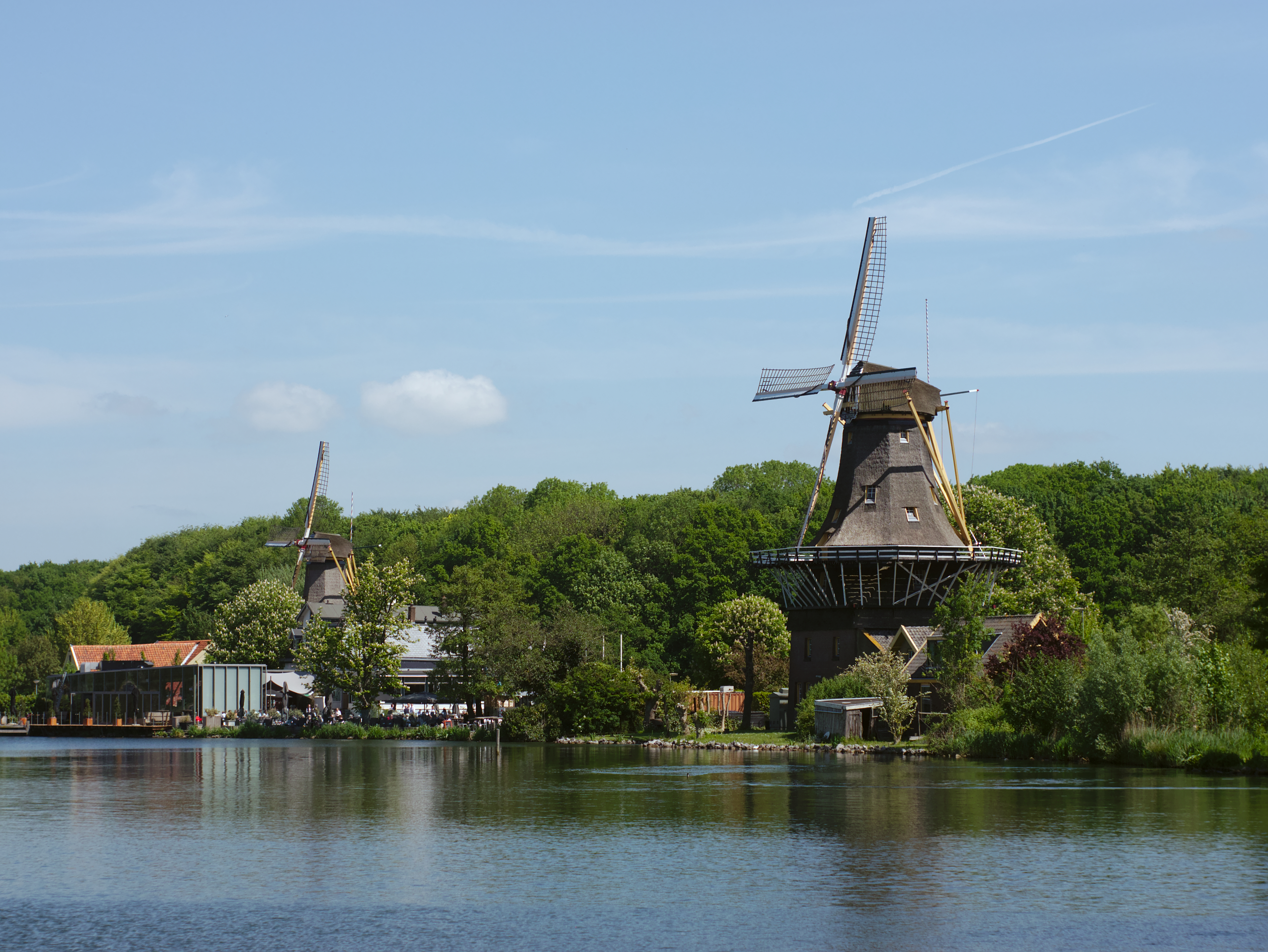 Windmills "De Lelie" (left) and "De Ster" (right) as seen from one of the islands in the south of the Kralingse Plas in Kralingen, Rotterdam.