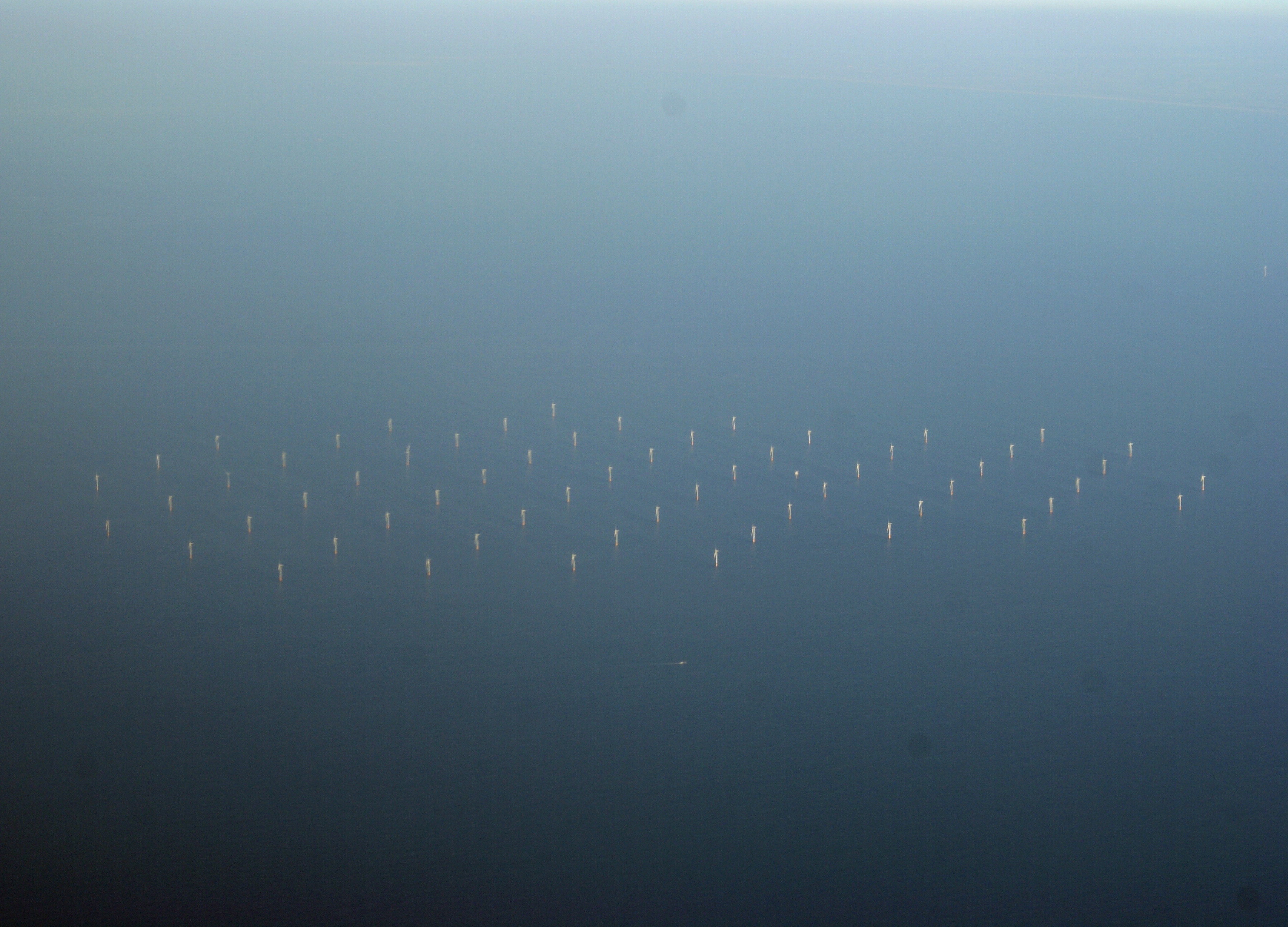 Photo of (presumably) Princess Amalia wind farm in the North Sea, 23 km from IJmuiden. Taken from a plane flying from BHX to AMS. I auto stretched the contrast in the Gimp. I assume it's the Princess Amalia wind farm, since the other wind farm in the vicinity (OWEZ) has 36 turbines whereas the one picture has 60.