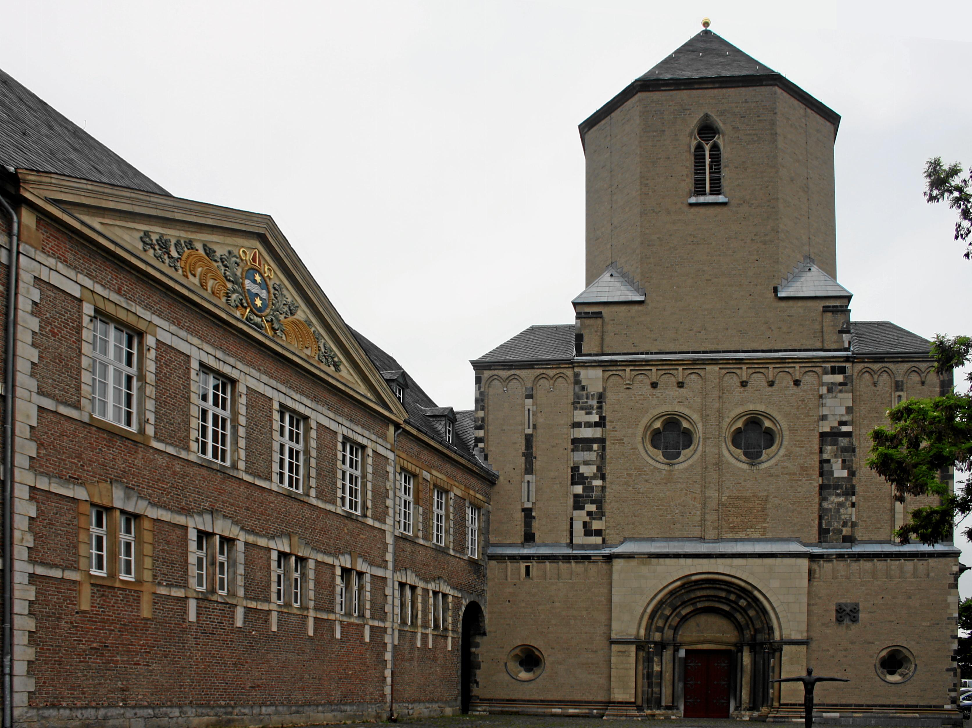 Mönchengladbach, Germany. Roman-catholic church St. Vitus, exterior view from East, and south-wing of the former abbey buildings (today: town hall).