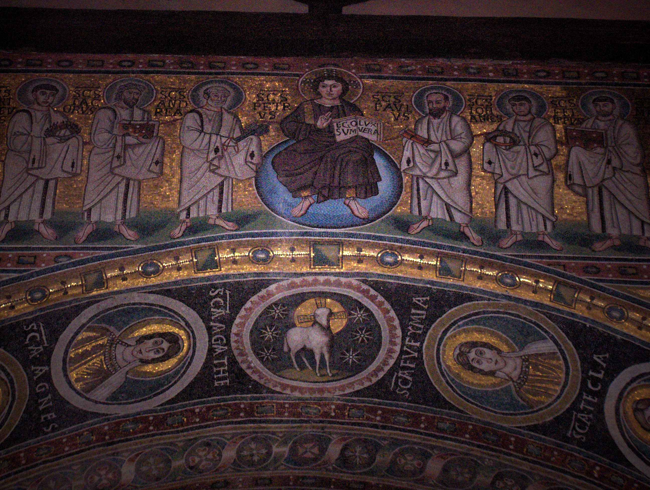 Mosaic with young Christ holding a book with the text "Ego sum lux vera" (I am the true light); on His left and right : six apostles;apse of   the St. Euphrasius basilica, Poreč, Croatia