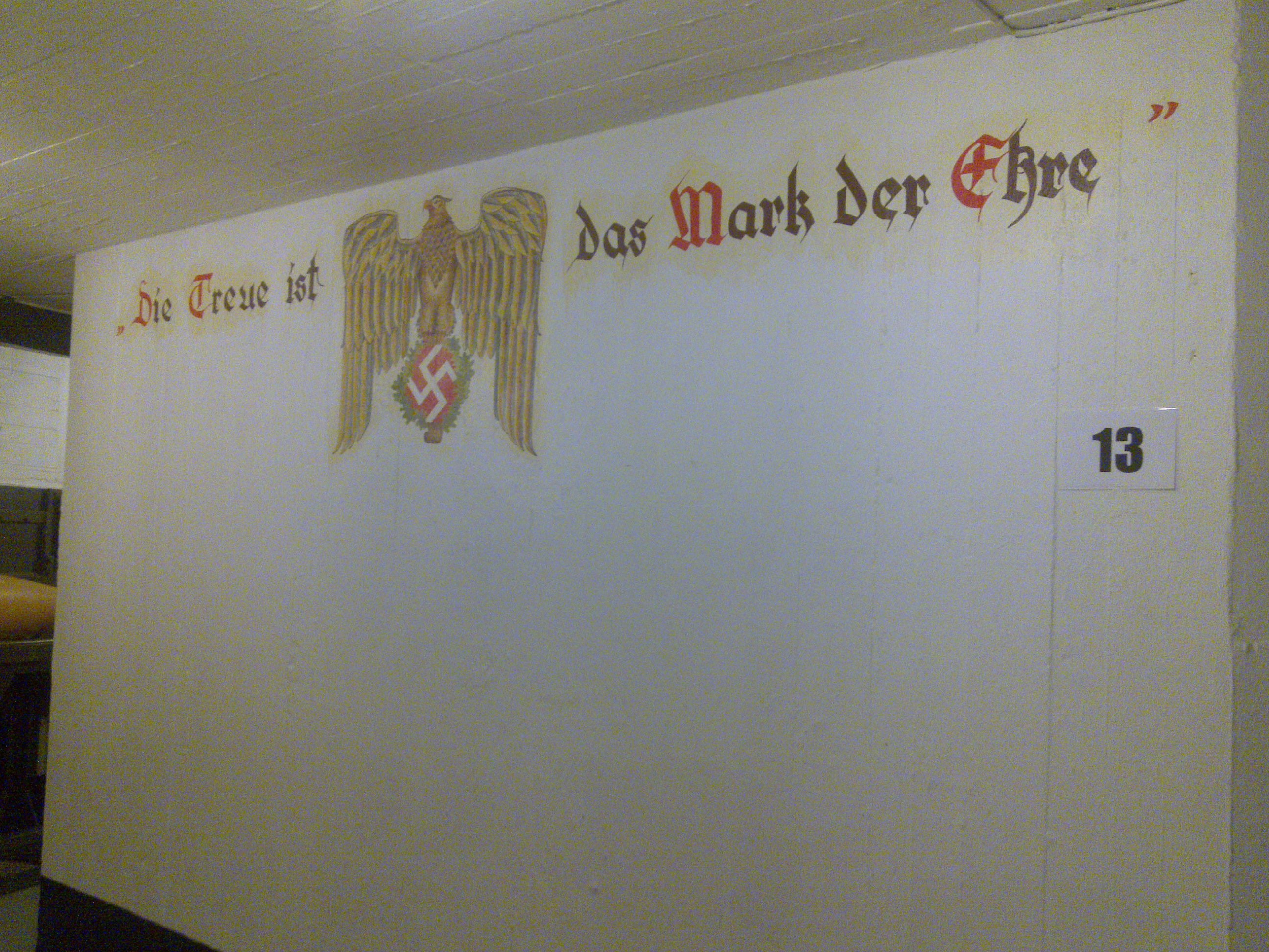 Batterie Vara, Kristiansand (Norway). Restored wall painting: "Lojalty is the mark of honour".