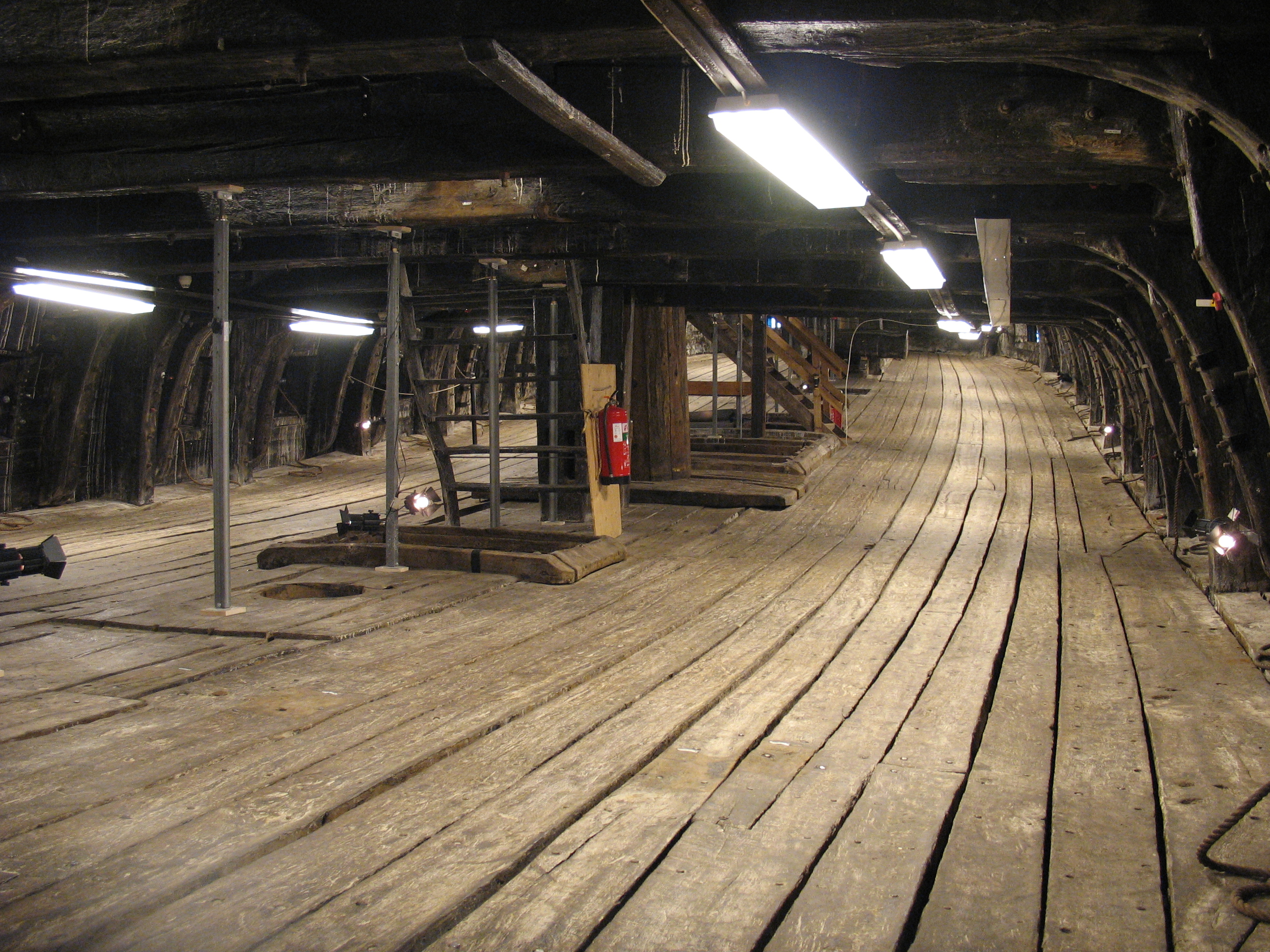 The lower gun deck of the warship Vasa, displayed in the Vasa Museum in Stockholm, Sweden. Picture taken inside the ship looking forward.