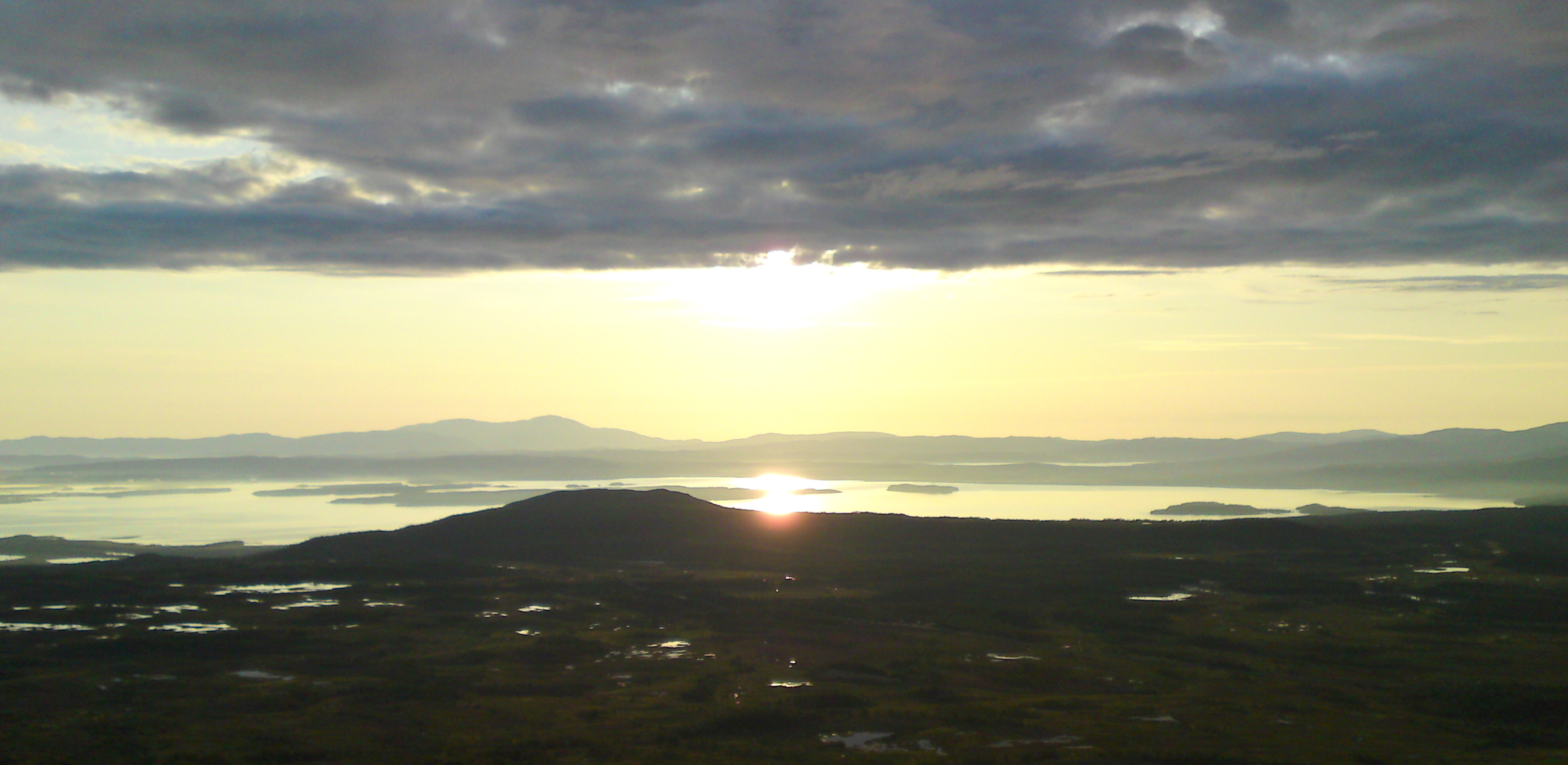The rising Sun reflected on Lake Ånnsjön, Jämtland, Sweden.