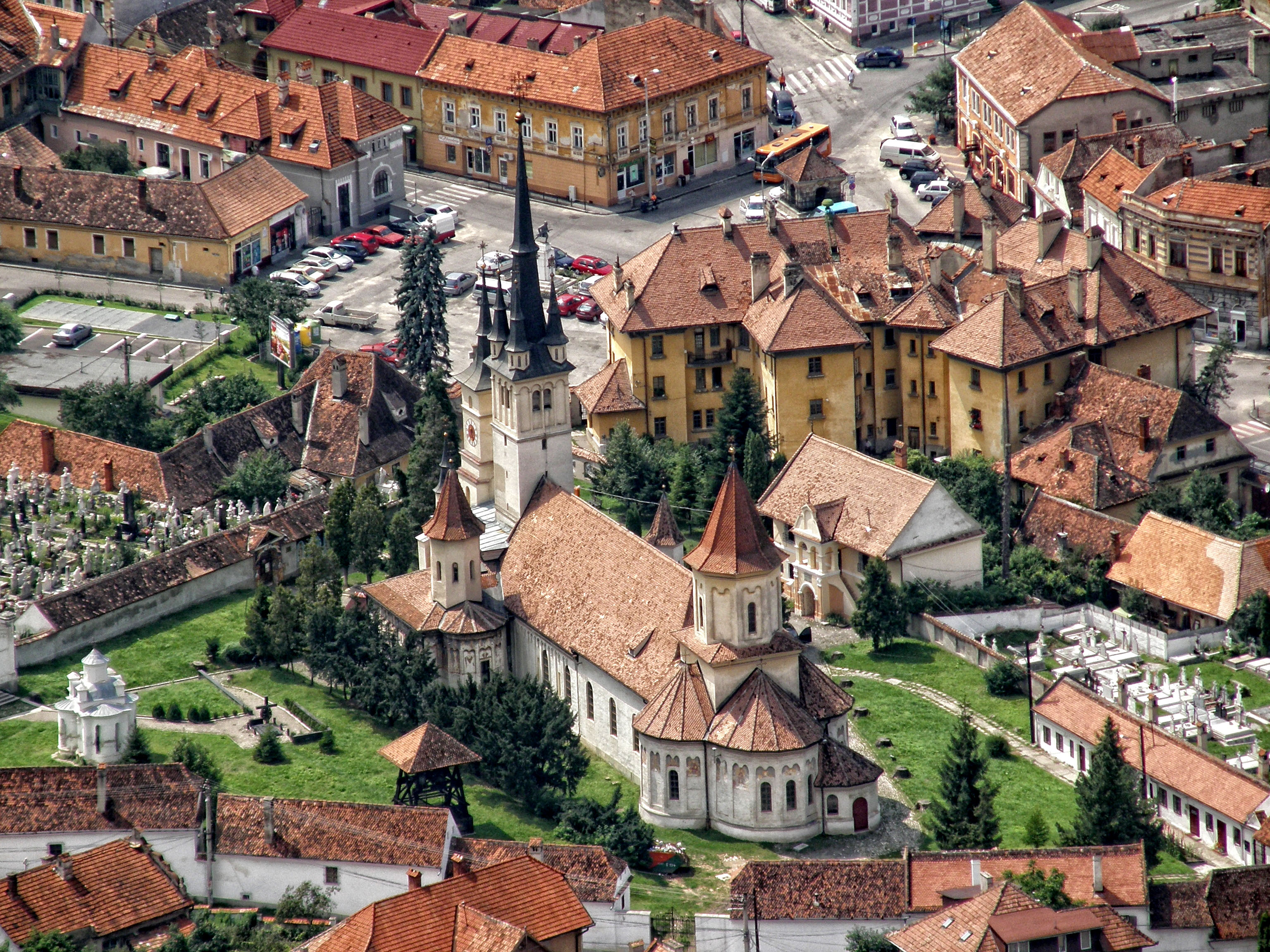 Aerial view of historic Şchei district — in the city of Braşov.
With Romanian Orthodox walled compound of Saint Nicholas church and St Nicholas cemetery.
Located in southeastern Transylvania, central Romania.