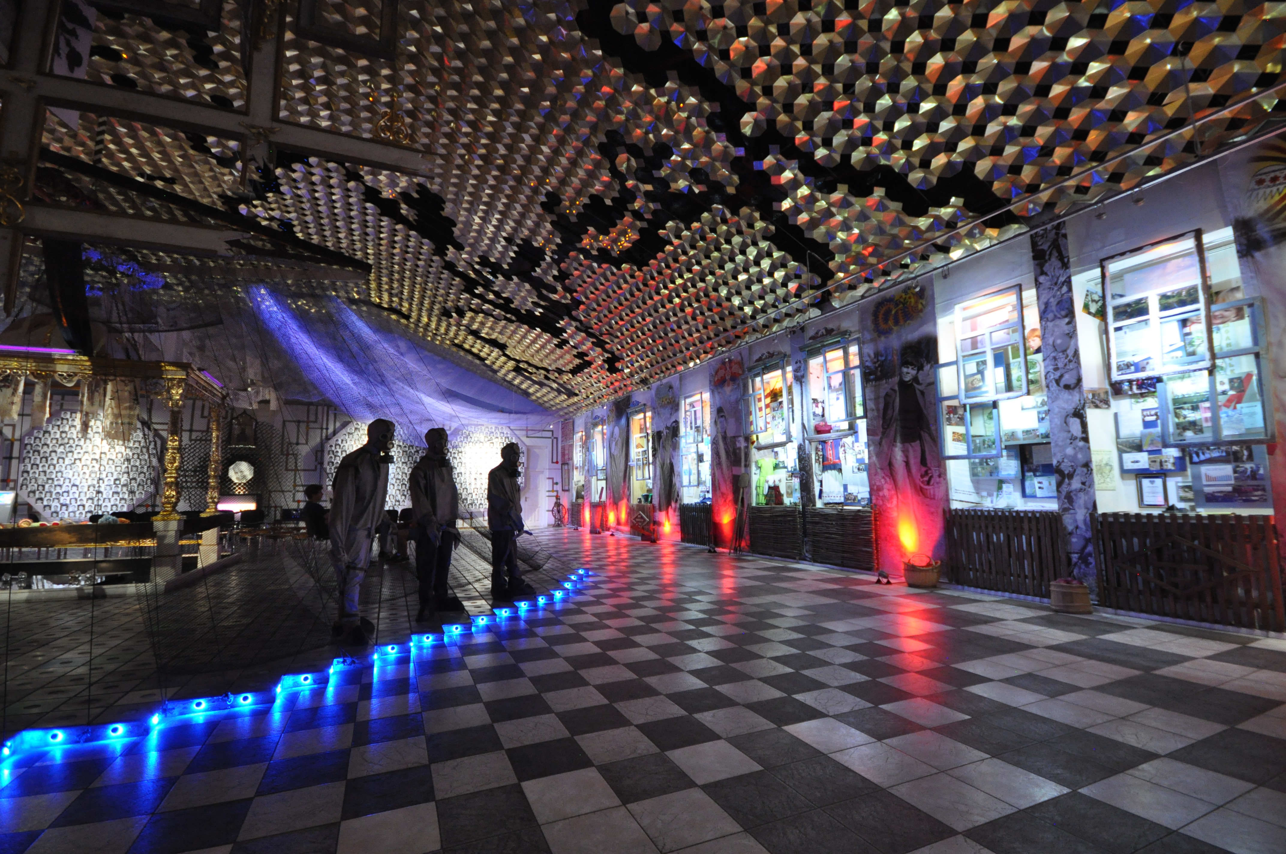 The Ukrainian National Chornobyl Museum is a history museum in Kiev, Ukraine, dedicated to the 1986 Chernobyl disaster and its consequences. It houses an extensive collection of visual media, artifacts, scale models and other representational items designed to educate the public about many aspects of the disaster. Several exhibits depict the technical progression of the accident, and there are also many areas dedicated to the loss of life and cultural ramifications of the disaster.
Due to the nature of the subject material, the museum provides a very visually engaging experience.
Symbolic display of "road signs" for the villages abandoned as a result of the disaster. To stress the tragedy of devastation, the signs are colored in black (instead of standard blue/white) and slashed with pink stripe (which designates "end of the settlement" on the actual signs). Above the signs is an authentic Khorugv from the abandoned village church.

Museum occupies an early 20th century building which formerly housed a fire brigade and was donated in 1992 by the State Fire Protection Guard. [Wikipedia.org]