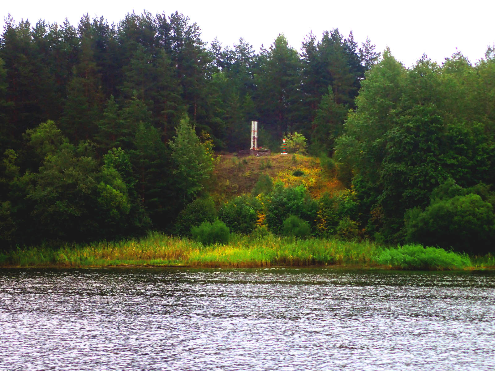 The site of general Ivan Fedyuninsky's command post on the east bank of Narva River in Tõrvala village, Estonia 1944 (now in Leningrad oblast, Russia). View from the west bank in Estonia.