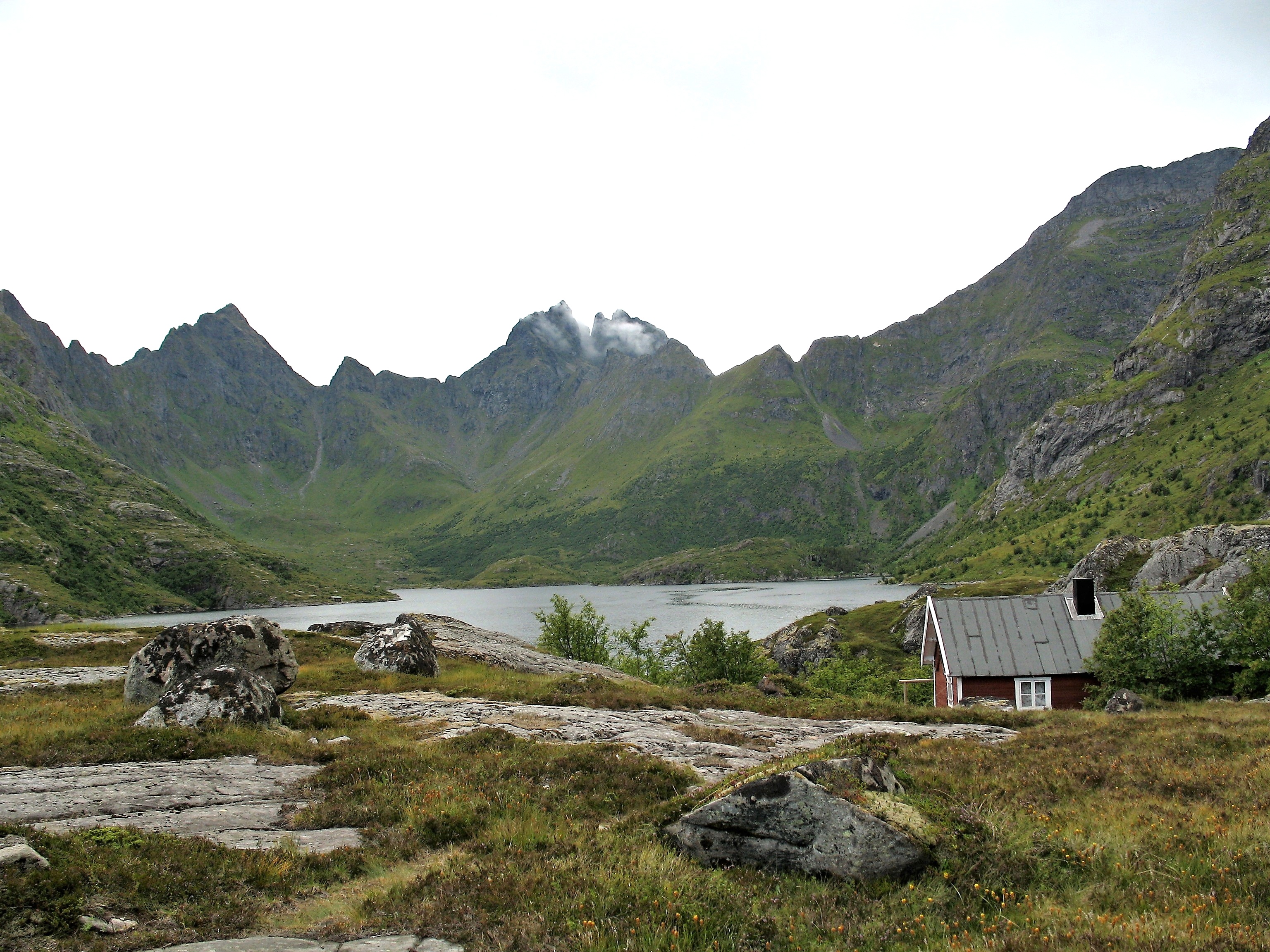 Lake Ågvatnet, Moskenes Island, Lofoten. Western banks with rocks and mountains Mannen and Gjerdtindan belongs to the Lofotodden National Park