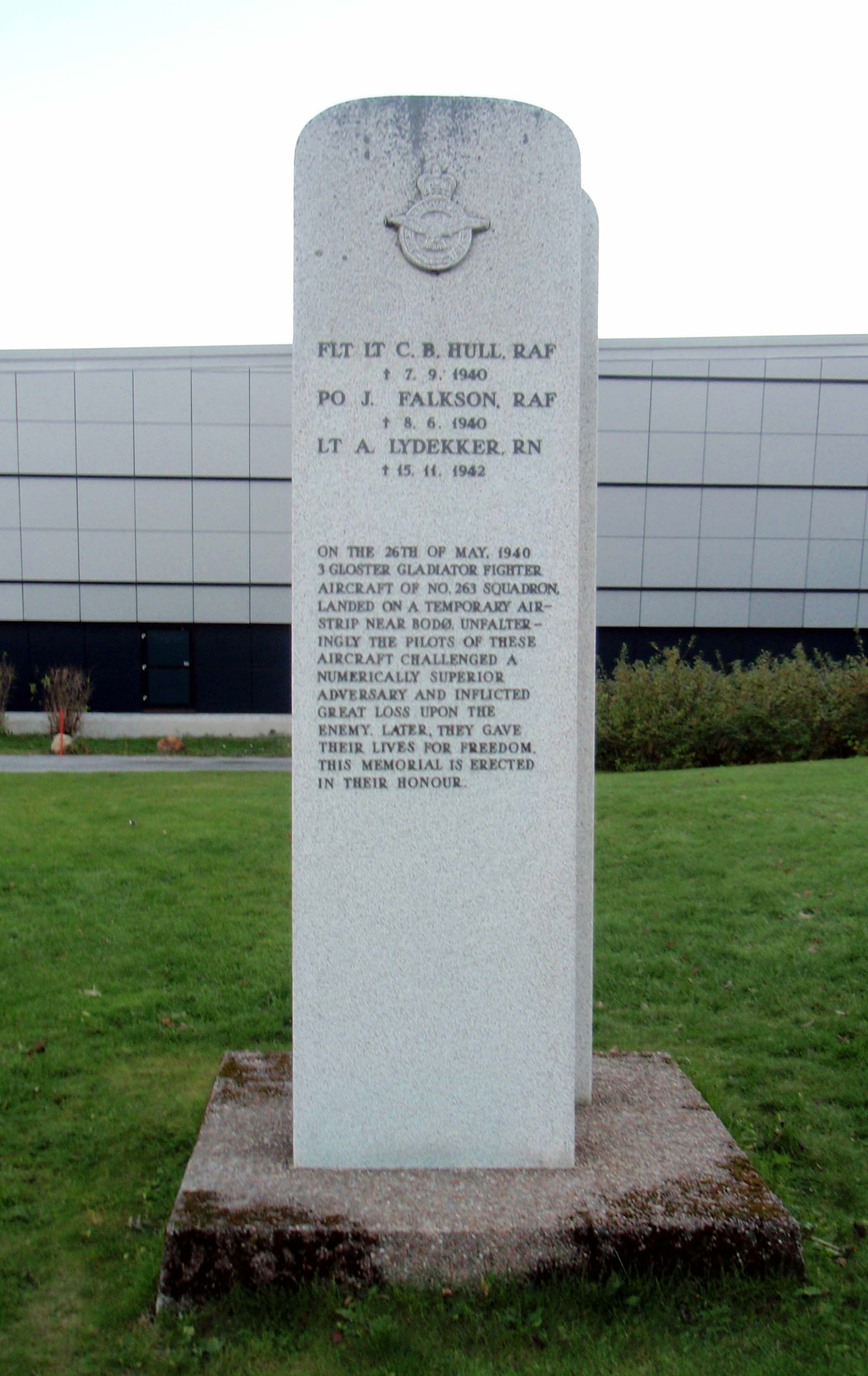 Memorial stone commemorating the three Gloster Gladiator fighter pilots who fought in the Bodø area in late May 1940—RAF pilots Flt Lt (later Sqn Ldr) Caesar Hull (Rhodesian) and Plt Off Jack Falkson (South African), and Royal Navy pilot Lt Tony Lydekker. All three pilots later perished during the Second World War. The memorial stone is located next to the Norwegian Aviation Museum.