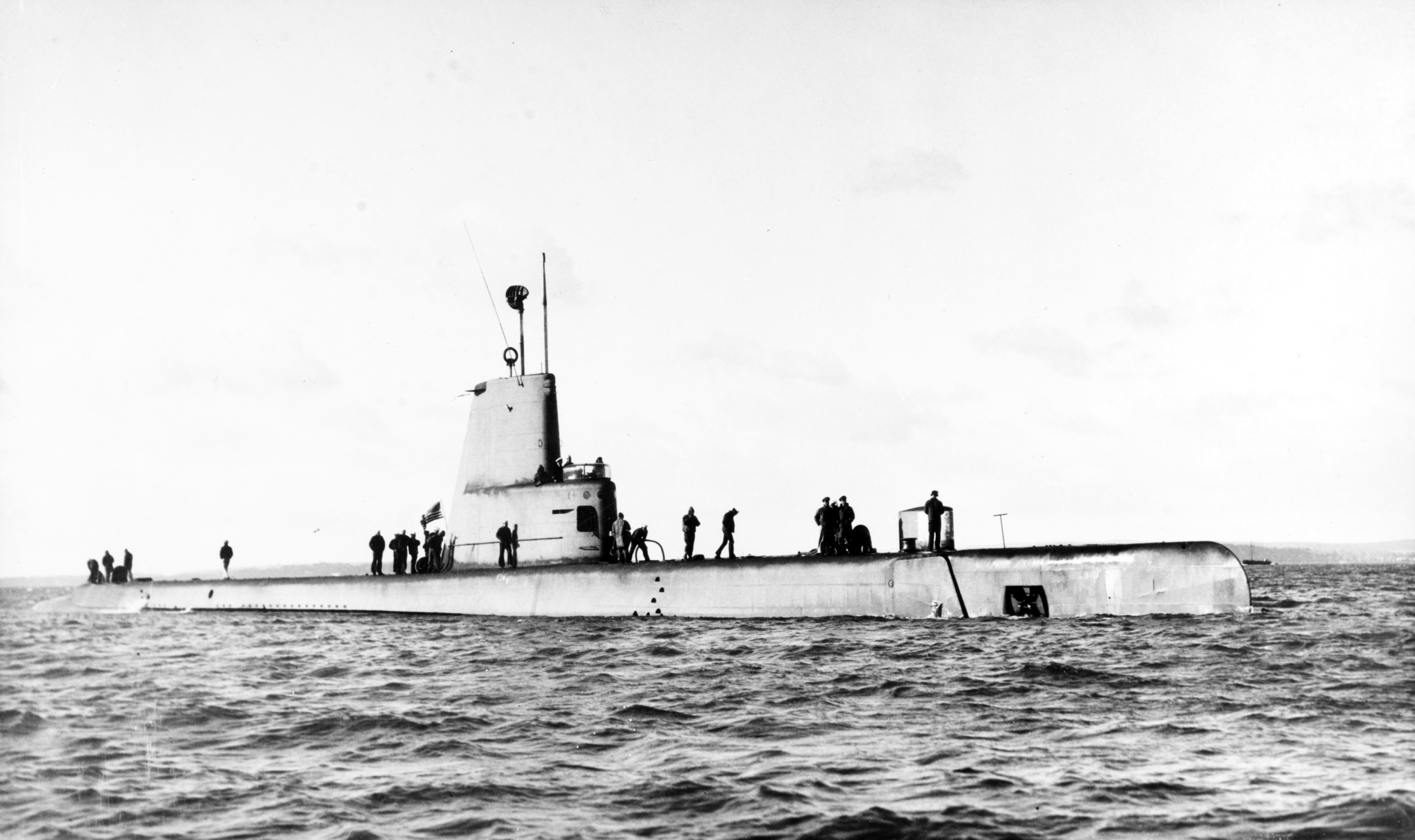 The U.S. Navy submarine USS Cochino (SS-345) leaving Portsmouth, Hampshire (UK), for the Barents Sea, circa July 1949. Cochino was sunk on 25 August 1949, following a battery explosion while operating off Norway.