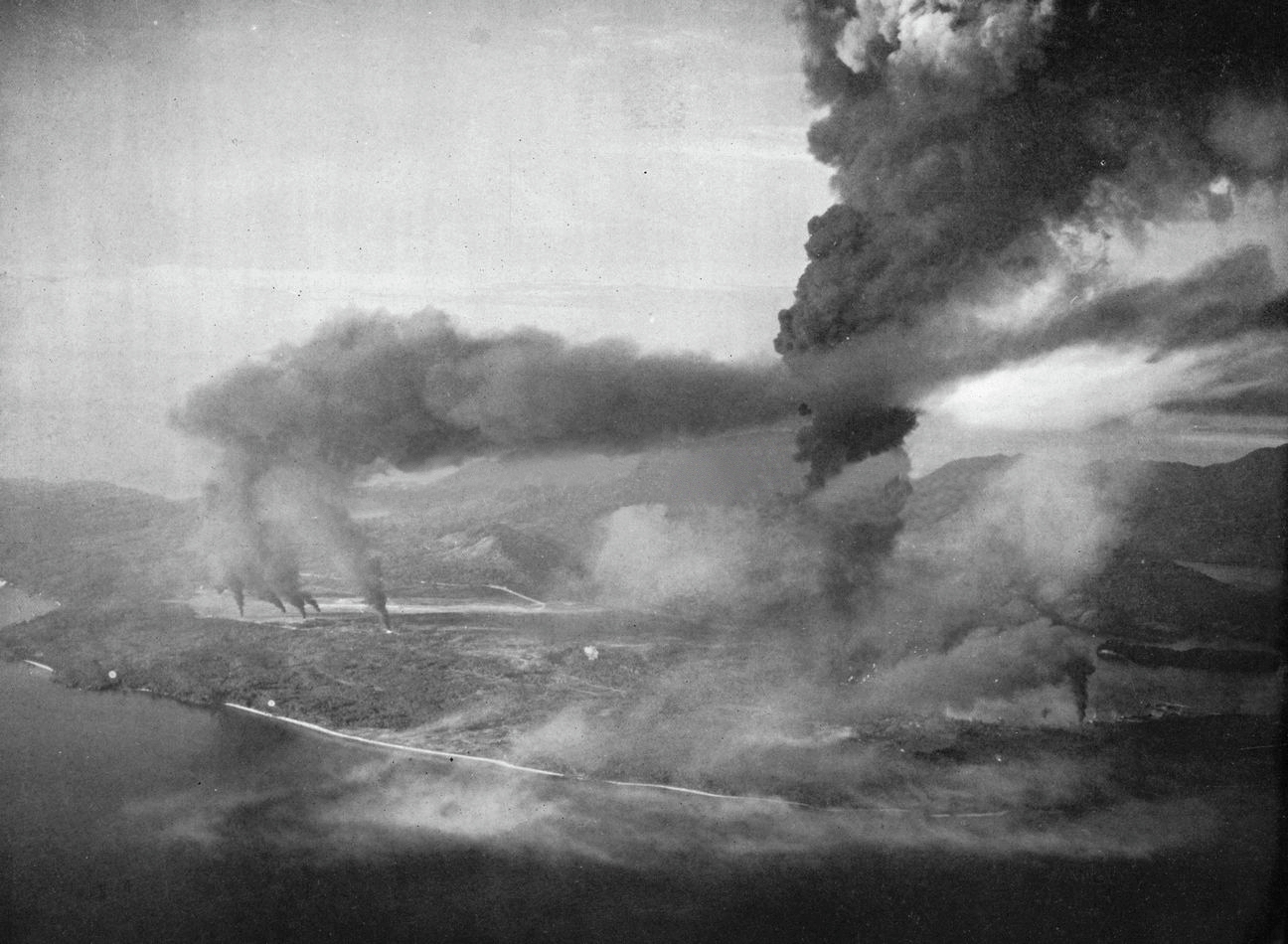 View of the attack on Sabang, Netherlands East Indies, on 19 April 1944 by aircraft from the aircraft carriers USS Saratoga (CV-3) and HMS Illustrious (87) during "Operation Cockpit".
