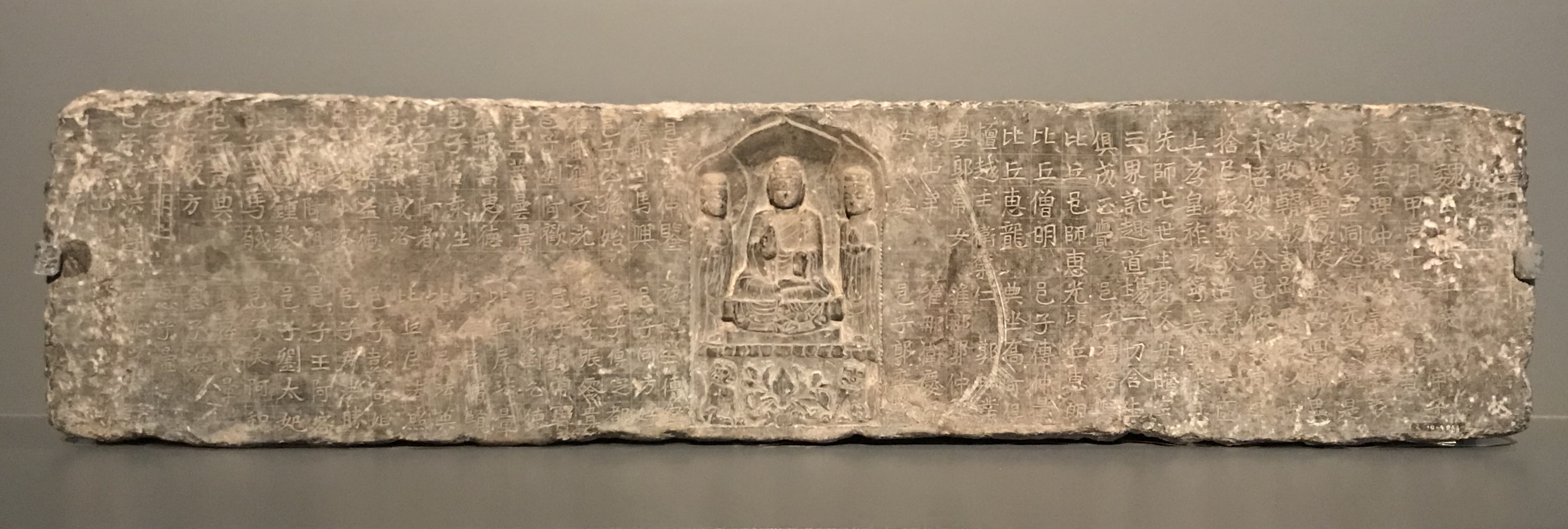 Stele inscribed with Buddhist texts, with image of Buddha and two bodhisattvas. Dated 544 (Eastern Wei dynasty). Museum of Asian Civilizations, Singapore.