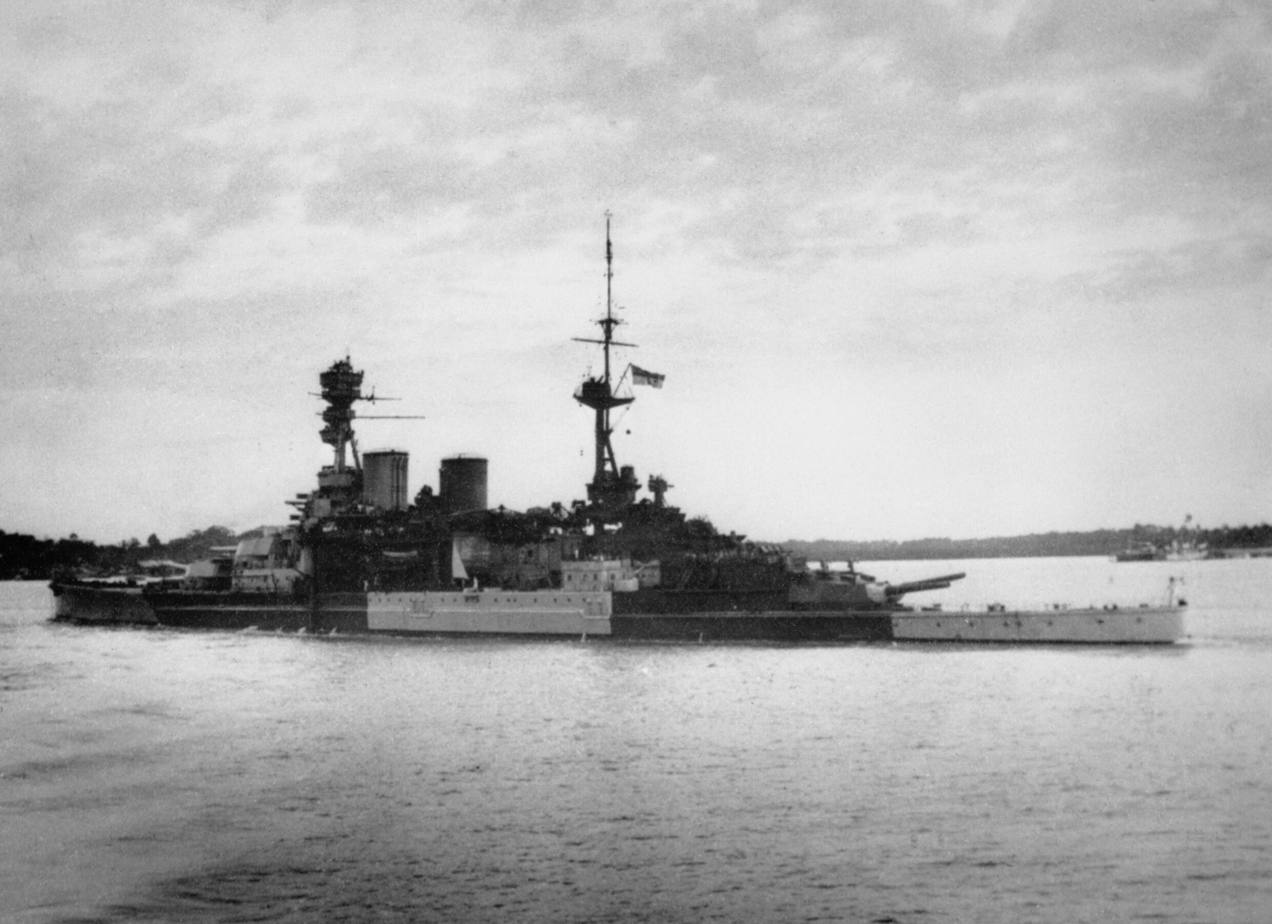 British battlecruiser HMS Repulse sailing from Singapore on her last operation. Two days later she was sunk with great loss of life by Japanese aircraft along with HMS Prince of Wales.