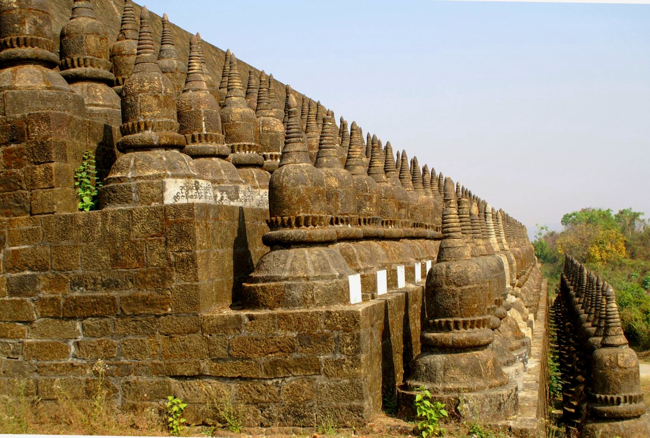 This temple situated near the city of Mrauk U, 2km East, was built between 1553 and 1556 by King Dikkha, the son of King Min Bin when the Kingdom was prosperous ...
The name Paya Koe Thaung , means 'Temple of 90,000 Buddha Images'

Each little Stupa is representative of the Buddha's Image