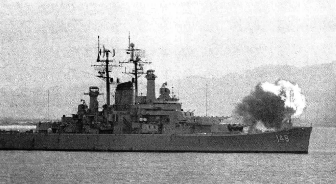 The U.S. Navy heavy cruiser USS Newport News (CA-148) firing on North Vietnamese positions on Cồn Cỏ Island (Tiger island) off Cửa Việt, Vietnam, 27 June 1972. She supported a landing of of South Vietnamese Marines.