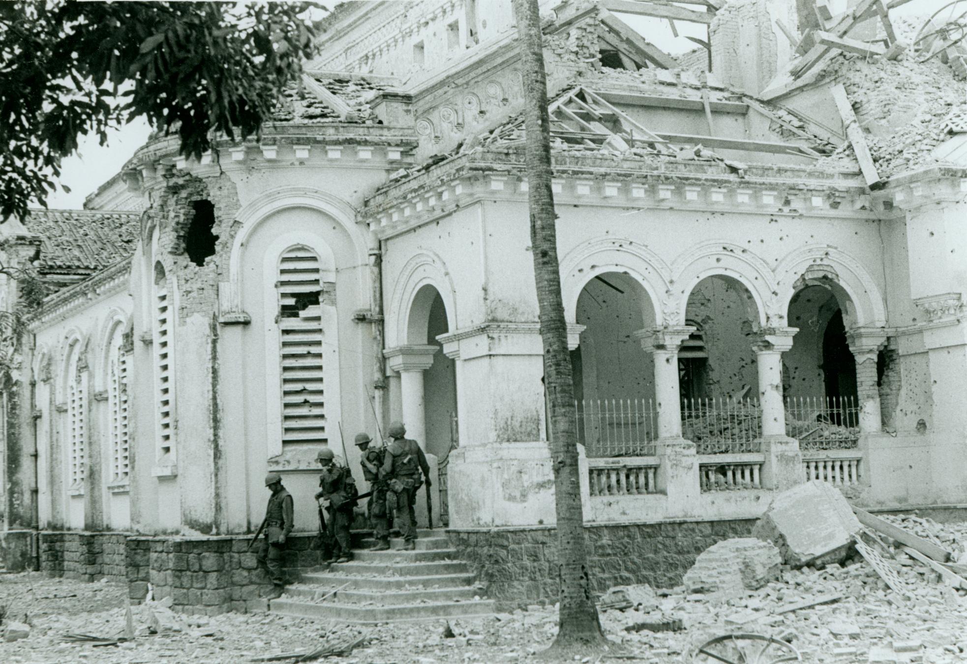 "After the Battle: A Company, 1st Battalion, 1st Marines [A/1/1] leave church after successfully capturing it from North Vietnamese control during one of the bloody battles taking place in Hue (official USMC photo by Sergeant Bruce A. Atwell)."
From the Jonathan Abel Collection (COLL/3611), Marine Corps Archives &amp; Special Collections.

OFFICIAL USMC PHOTOGRAPH