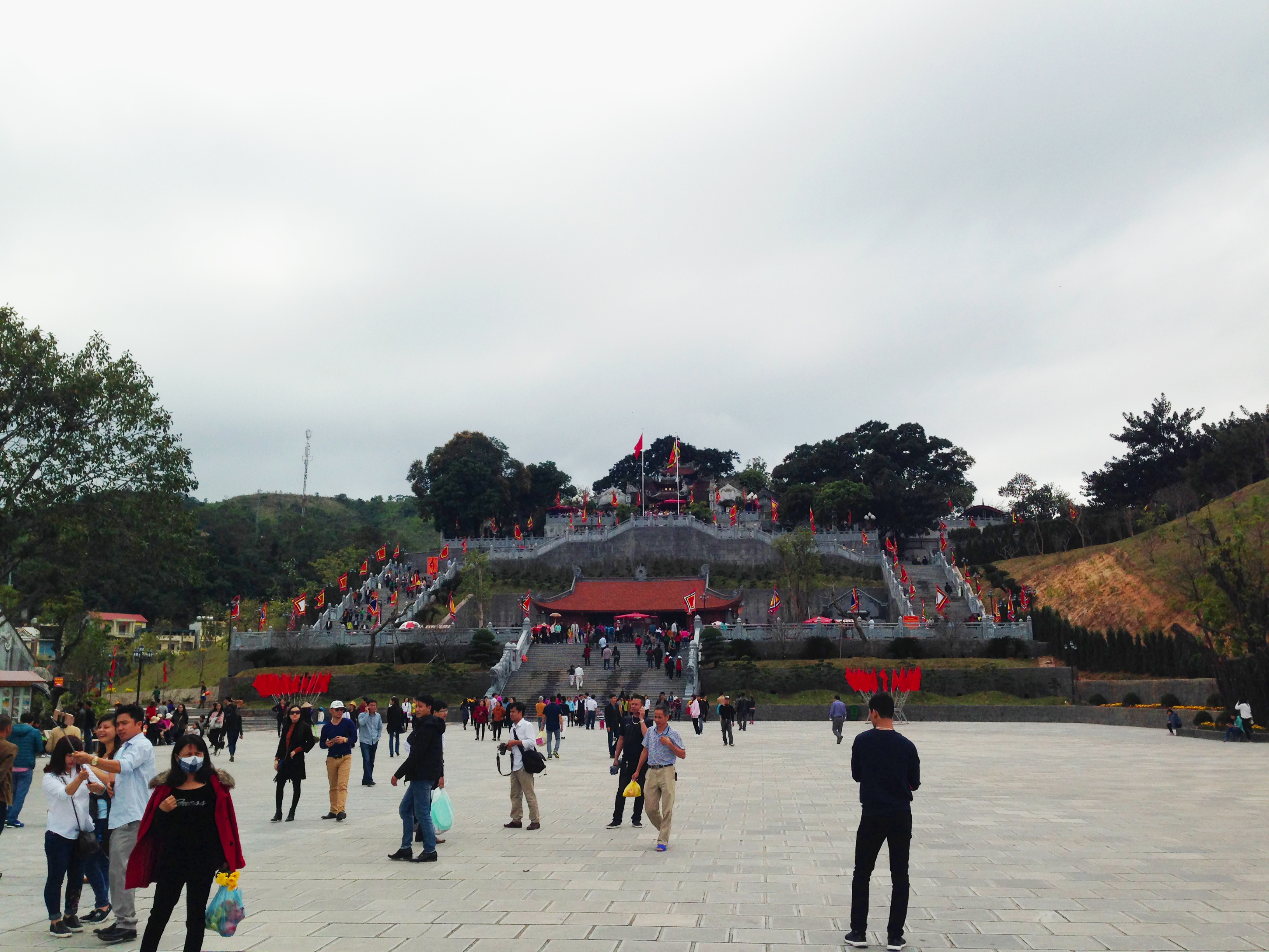 Cửa Ông Temple with Middle Shrine and Top Shrine on the carved hill with new blue-stone staircases and front courtyard with blue-stone pavers