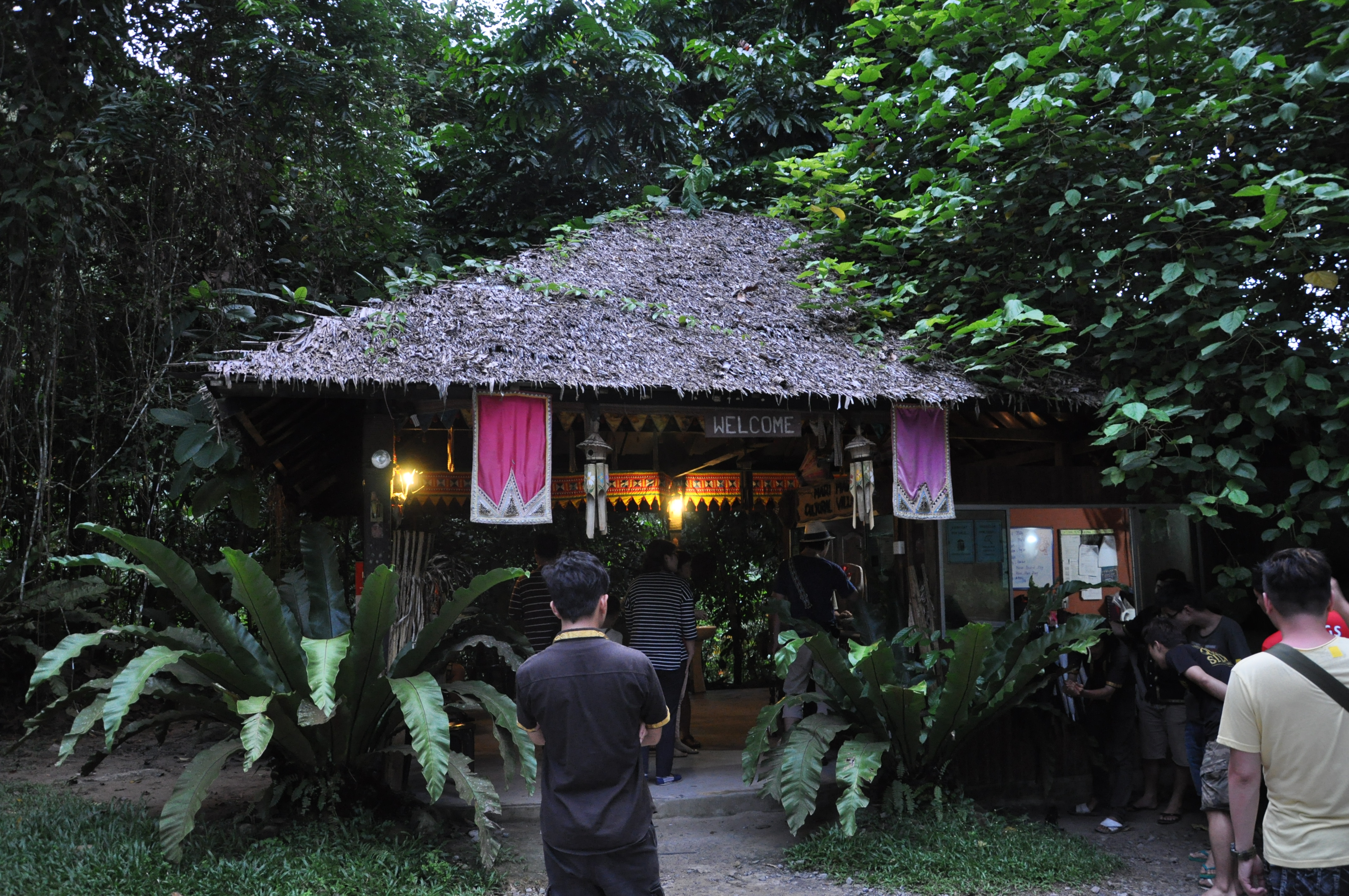 The next halt and the last halt for the day was the Mari Mari Cultural village. Seen here is the entrance hut and ticket office of the park, set in the fading evening light. The village, is actually a theme park of sorts which introduces you to various traditional homes of Sabahan ethnic communities—the Bajau, Lundayeh, Murut, Rungus and Dusun—which are built by descendants of the tribes which they represent. (Kota Kinabalu, East Malaysia, Nov. 2013)
