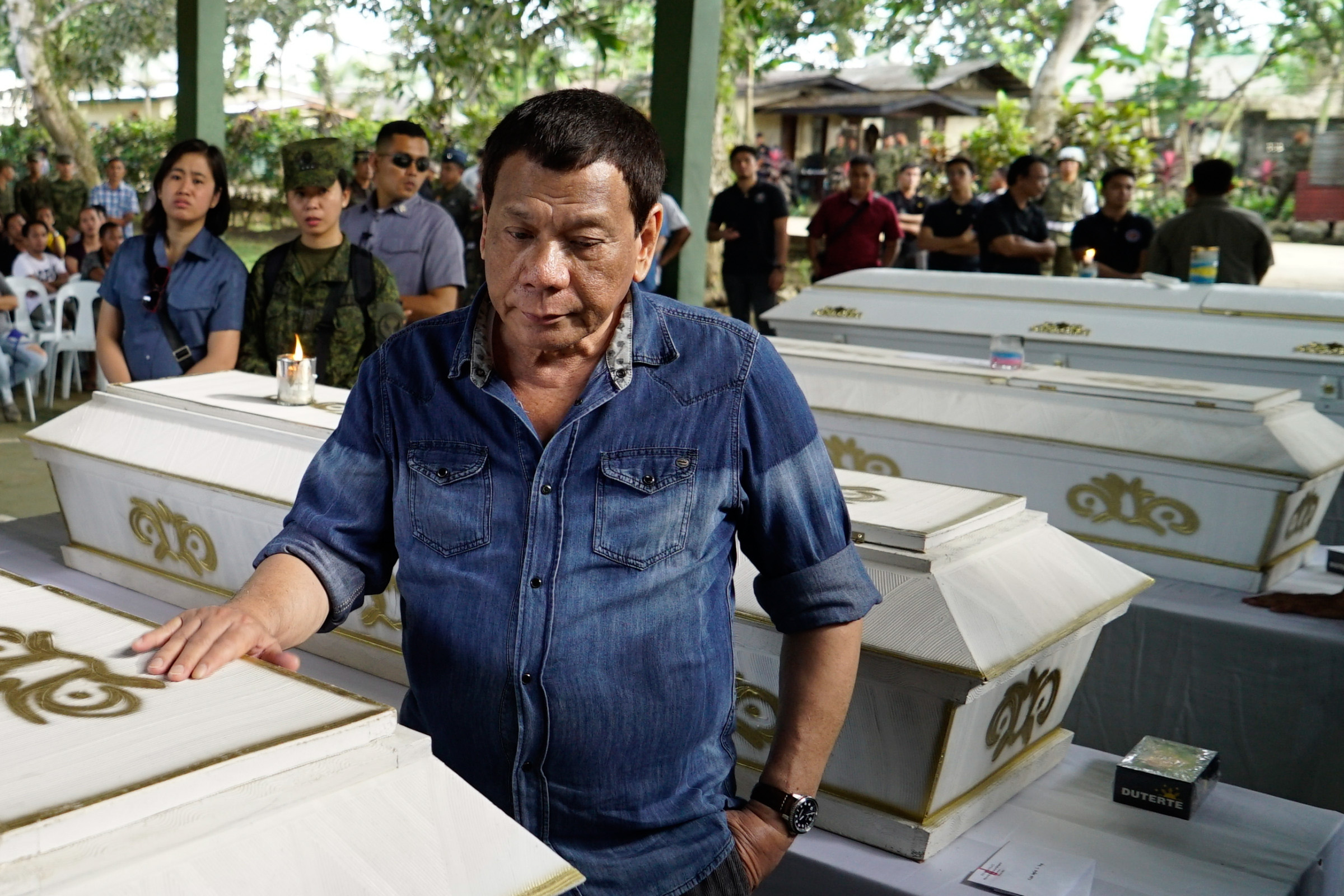 President Rodrigo Roa Duterte pays his last respects to one of the victims who died during the twin bombings at the Cathedral of Our Lady of Mount Carmel in Jolo, Sulu as he visited Camp Teodulfo Bautista in Jolo on January 28, 2019.