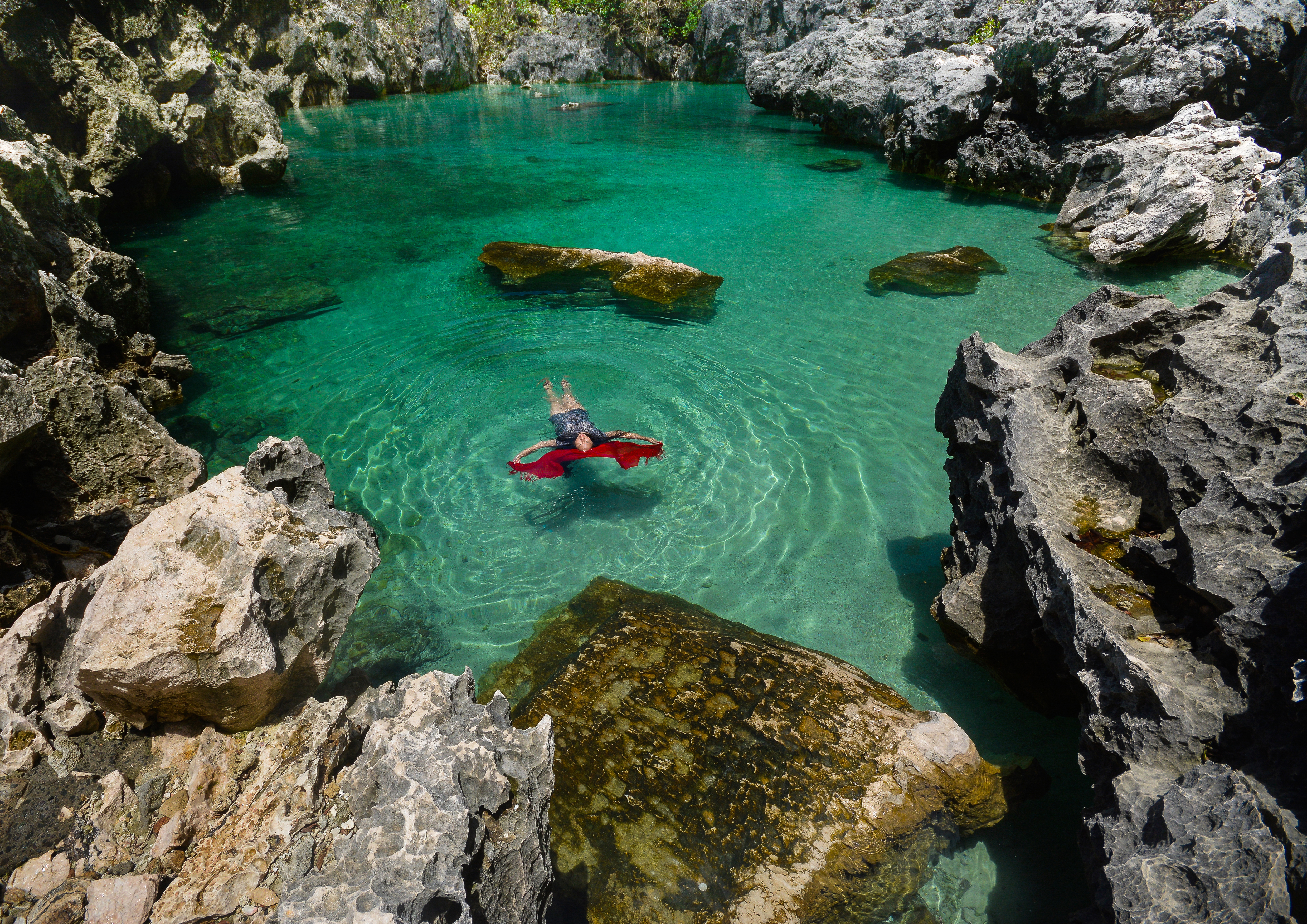 A tranquil saltwater lagoon that could be found in the middle of the ocean. This is a masterpiece that molded by nature for centuries. It a natural saltwater pool located in a hidden spot behind the steep cliffs of Isla de Gigantes  Sur in Carles, Iloilo.