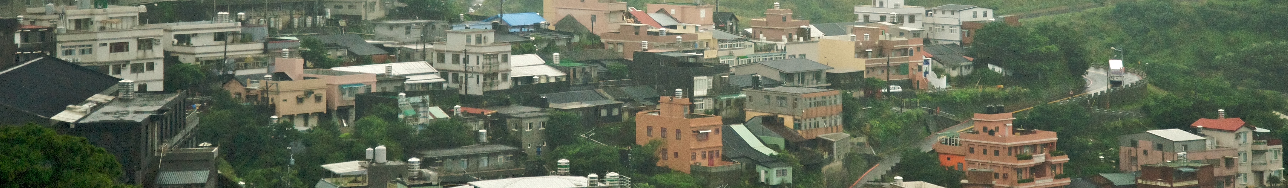 Thousands of tombs are strewn all over the mountain in the far background at Jinguashi