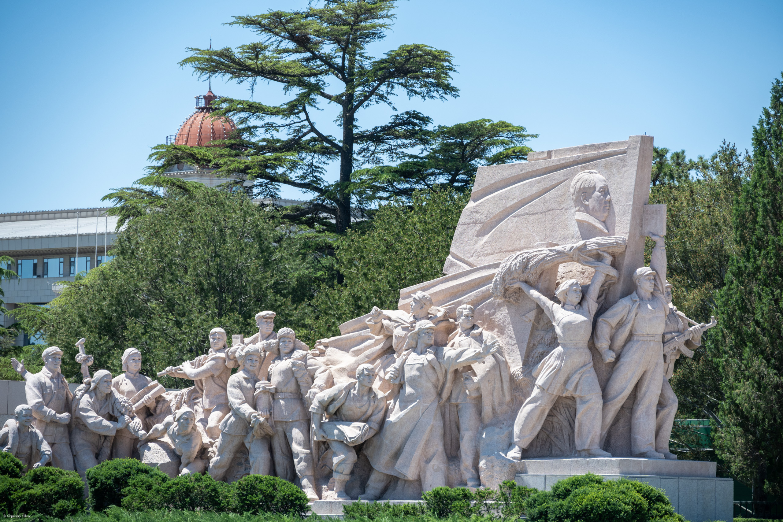 The Chairman Mao Memorial Hall, also known as the Mausoleum of Mao Zedong, is a significant historical site located in the heart of Beijing, China. It serves as the final resting place of Mao Zedong, the founding father of the People's Republic of China. This grand structure is a prominent feature of Tiananmen Square and stands as a symbol of China's revolutionary history. 

Visitors can pay their respects to Chairman Mao, whose body lies in a crystal coffin within the hall, which is a testament to his enduring influence on Chinese history and culture.