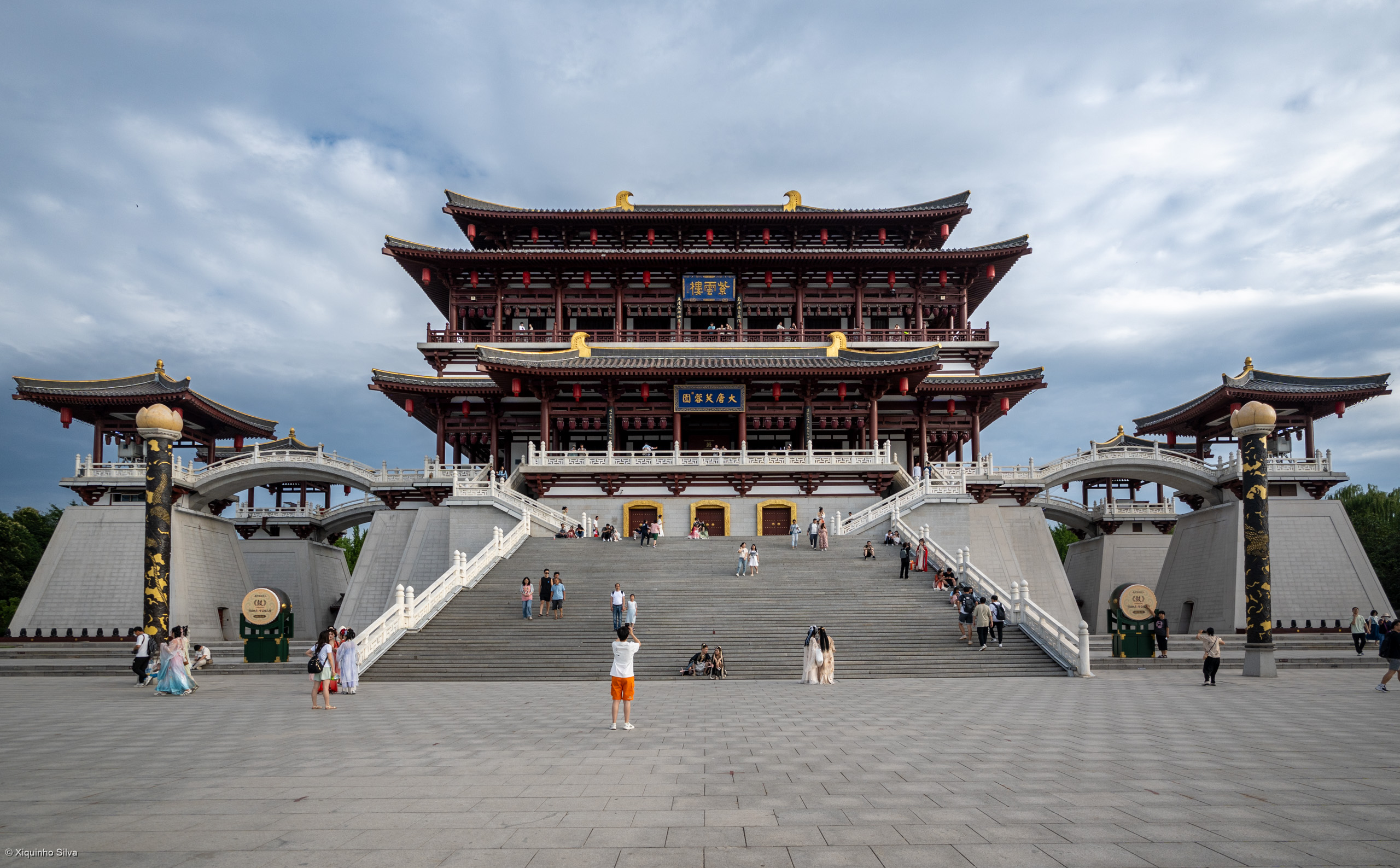 Tang Paradise is a cultural theme park located in the city of Xi'an, in Shaanxi Province, China. It is designed to celebrate the history and culture of the Tang Dynasty, offering visitors a full display of its grandeur and prosperity through various cultural themes and scenic regions. 

The park features a blend of traditional Chinese garden elements and modern entertainment, including water shows and aromatic incense burners that create a unique sensory experience. Visitors can explore architectural styles, enjoy performances, and immerse themselves in the rich heritage of one of China's most illustrious dynasties at Tang Paradise.