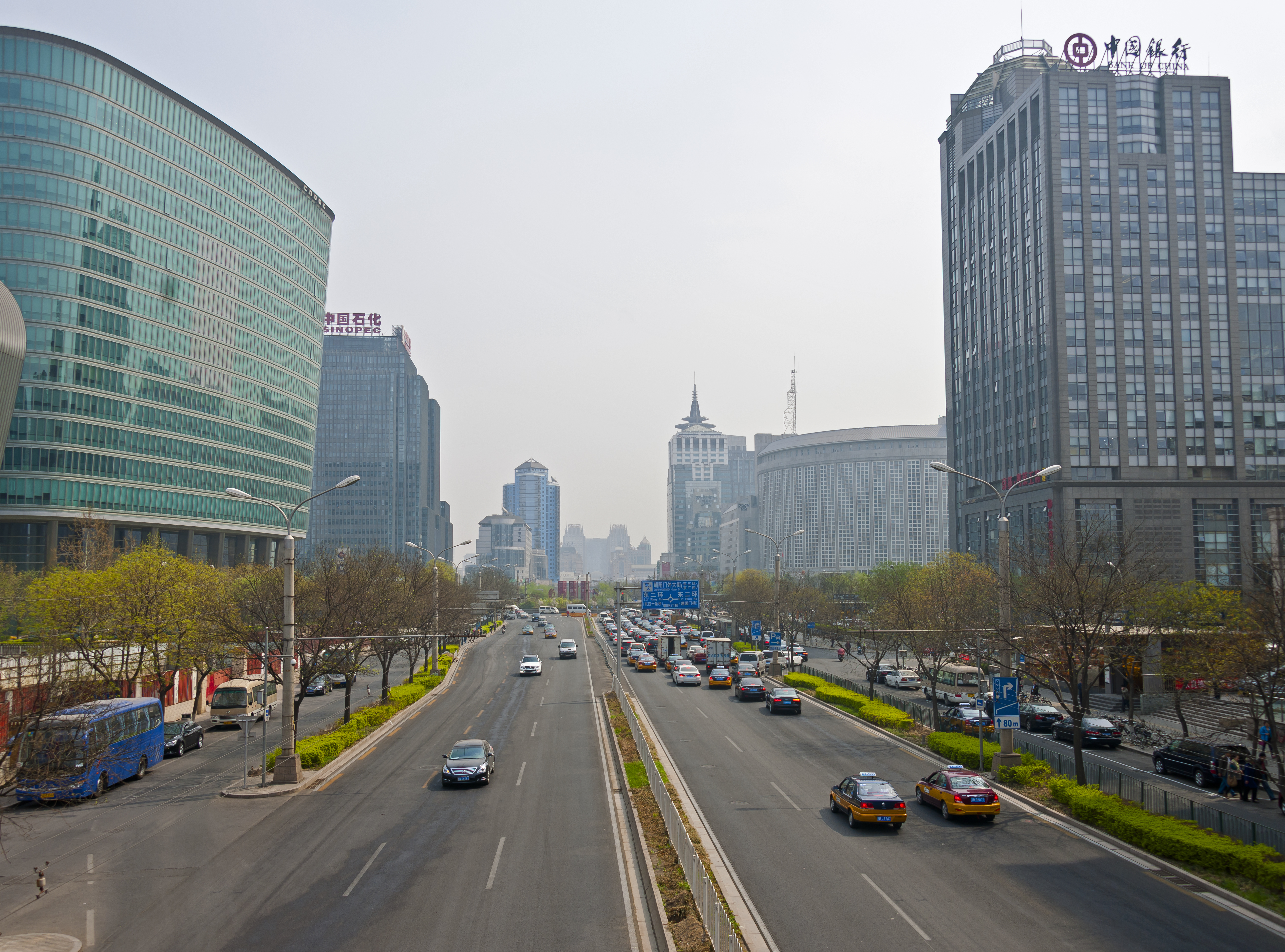 Looking east towards Chaoyangmen, Beijing, from pedestrian overpass over Chaoyangmen Inner Street just east of Second Ring Road junction. CNOOC headquarters building is on left.