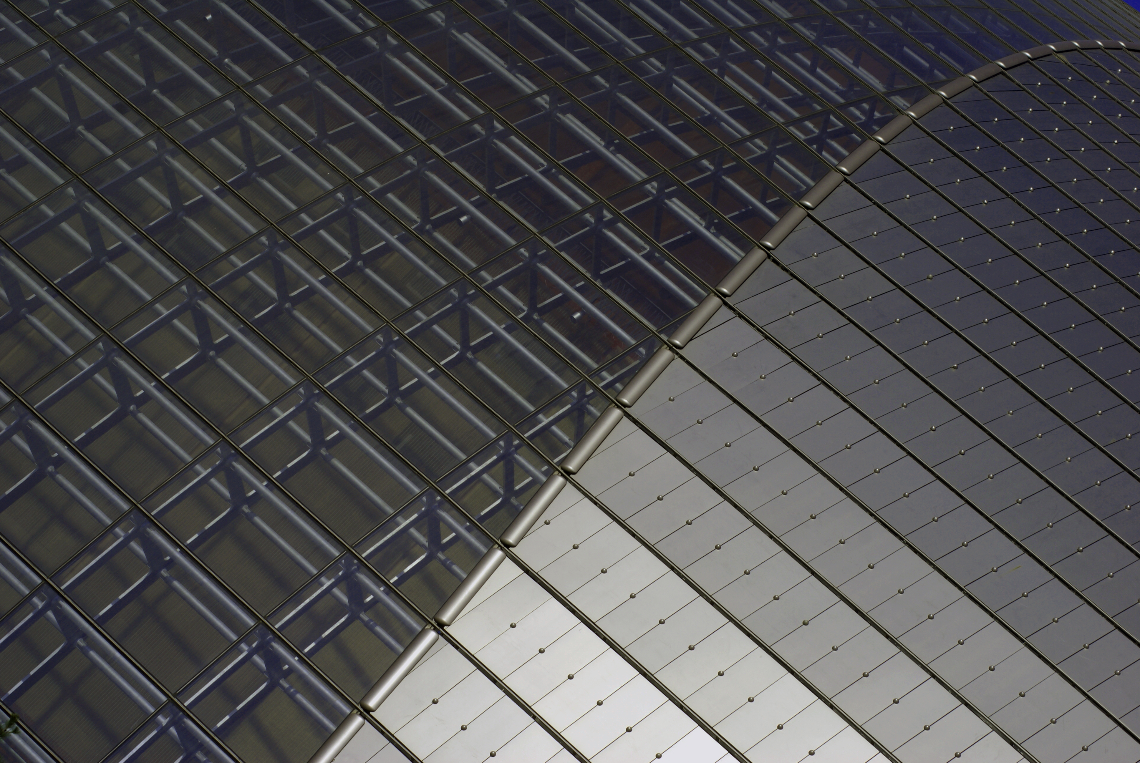 Detail of the National Grand Theatre in Beijing, China. Transition from glass to titanium portion of roof.