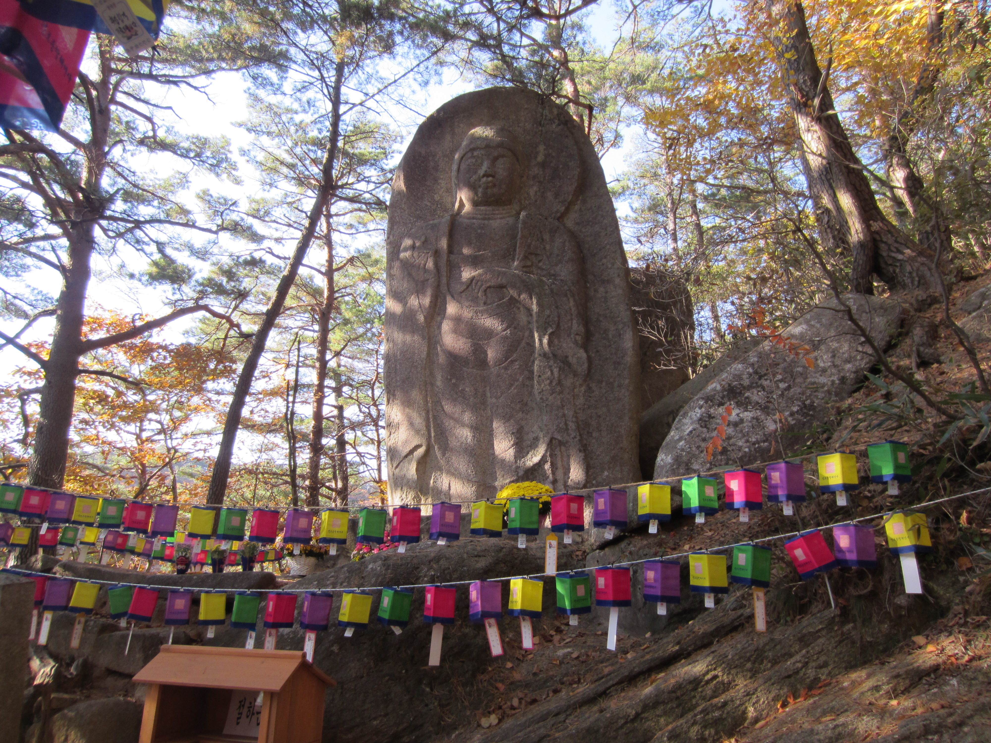 Picture of a stone relief of a standing Buddha (Treasure# 222) between Haeinsa temple and Mtn. Gaya, rarely open to the public.