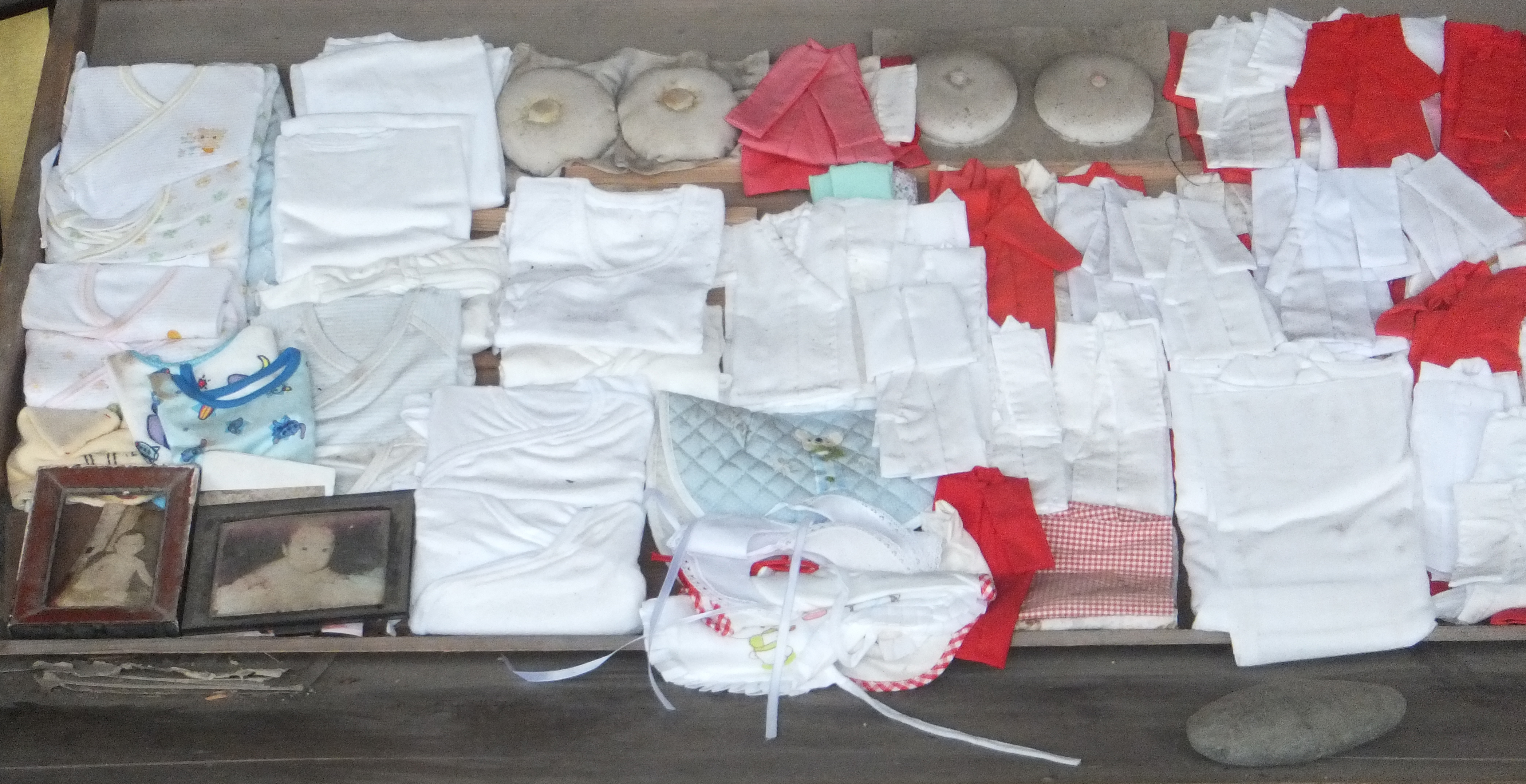 Votive offerings for the goddess of fertility and safe birth in the Mikumari-Shrine (Yoshino, Nara Prefecture, Japan)