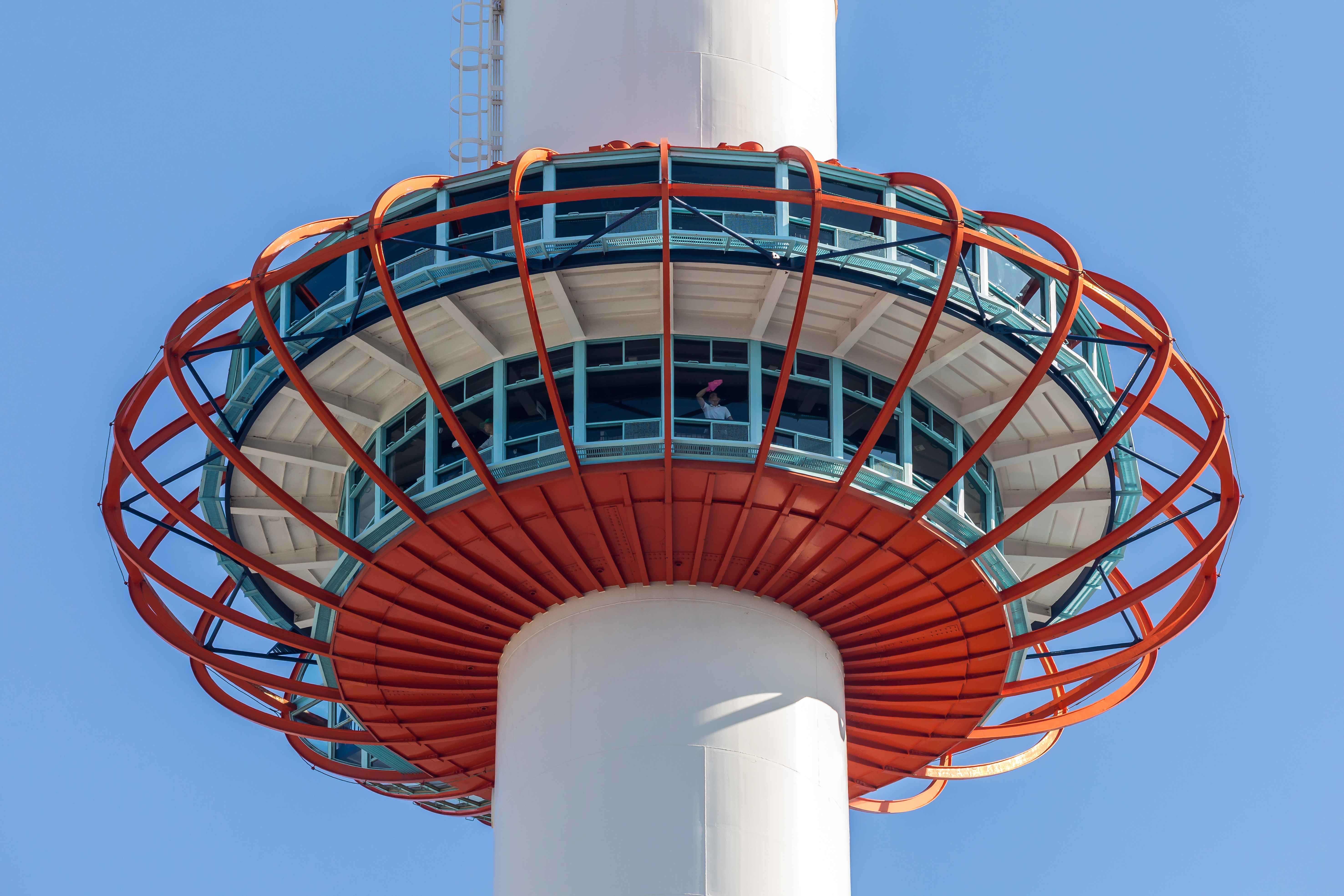 Observation deck at 100 m (328 ft), in Kyoto Tower with staff inside cleaning the windows, Kyoto, Japan. This steel tower is the tallest structure in Kyoto.