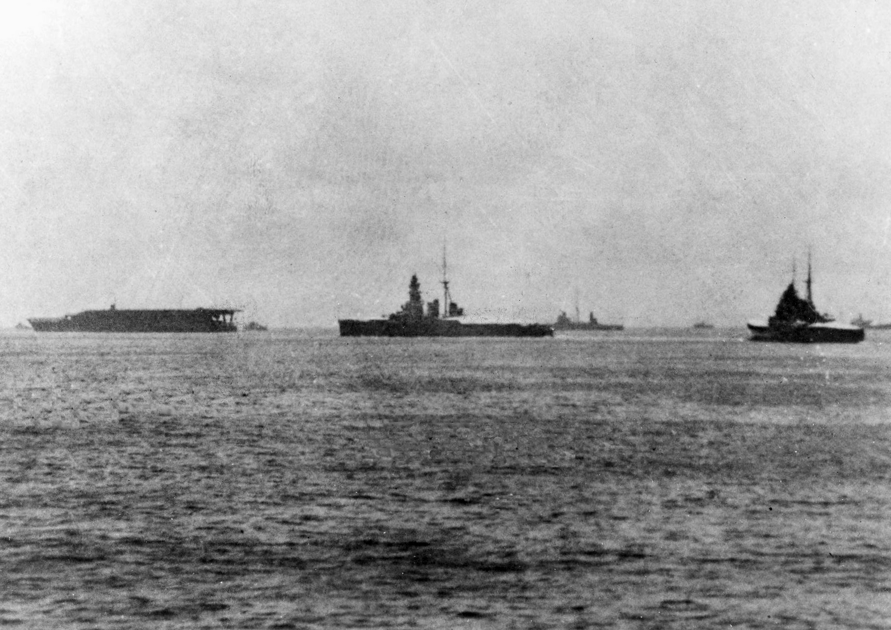 The Japanese aircraft carrier Akagi pictured with the battleship Hiei, coast defense ship Kasuga, and a Takao class heavy cruiser.