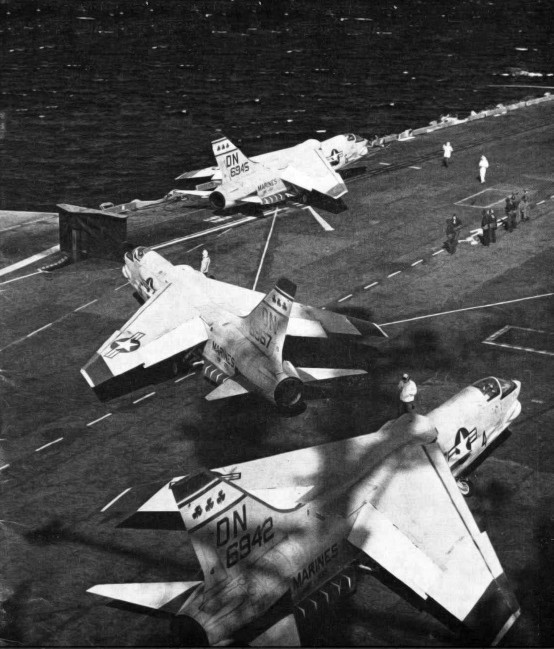 Three Vought F8U-2 (F-8C) Crusader fighters (BuNos 146942, 146945, 146957) of U.S. Marine Corps fighter squadron VMF-333 Fighting Shamrocks on the U.S. aircraft carrier USS Forrestal (CVA-59), ca. 1960.