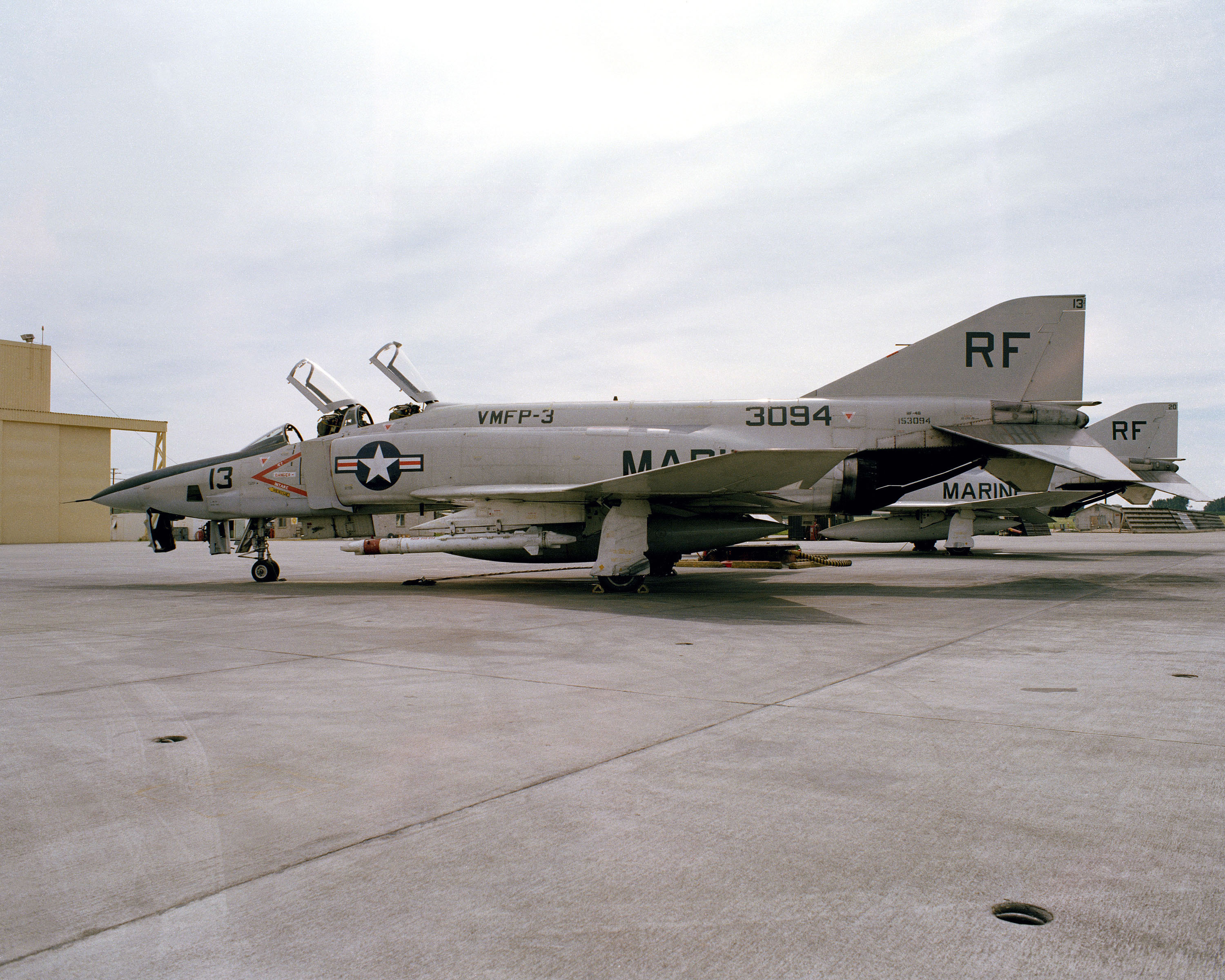 An U.S. Marine Corps McDonnell RF-4B-24-MC Phantom II aircraft (BuNo 153094) on the flight line of Marine Corps Air Station El Toro, California (USA), on 4 April 1978. The aircraft was assigned to Marine photo reconnaissance squadron VMFP-3 Eyes of the Corps and was finally retired to the AMARC as 8F0335 on 19 July 1989.