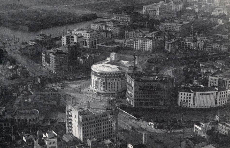 Aerial view of downtown Tokyo, Japan, Ginza district, with the imperial palace grounds in the background, circa in late 1949 or early 1950.