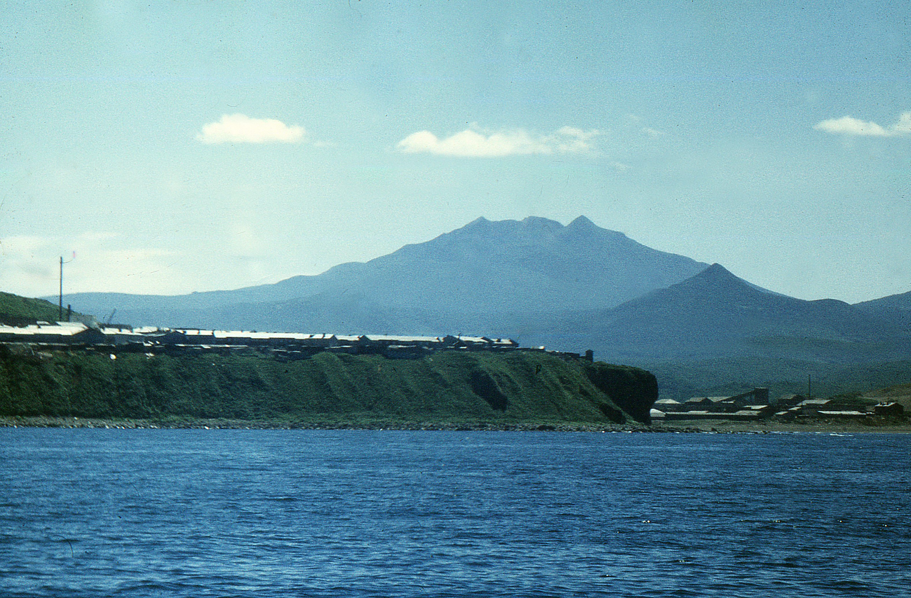 Baransky volcano as seen from the northwest, in Iturup Island, Russia. Kurilsk town in the foregrond.