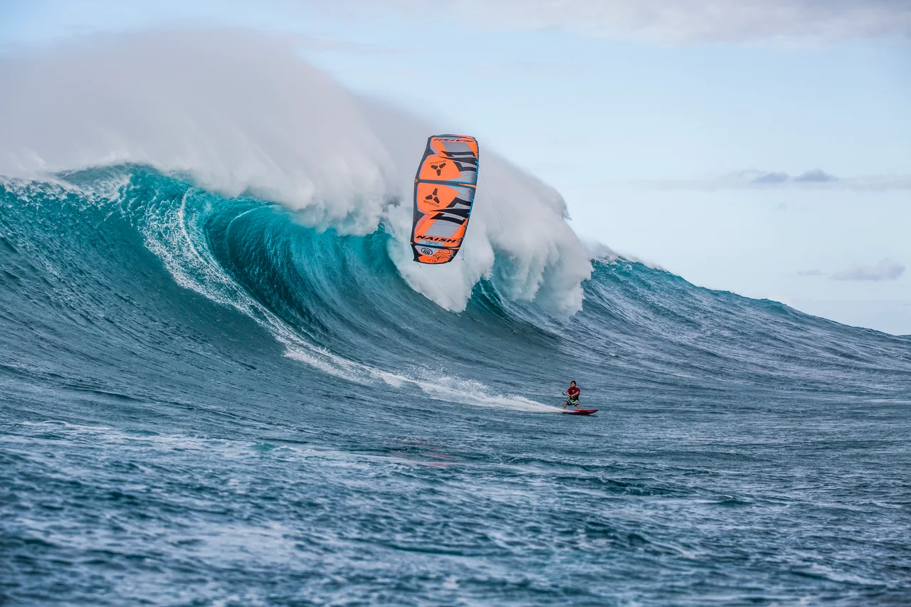 Jesse Richman, photographed by Pierre Bouras, kitesurfing at "Jaws", Peʻahi, Maui, Hawaii.