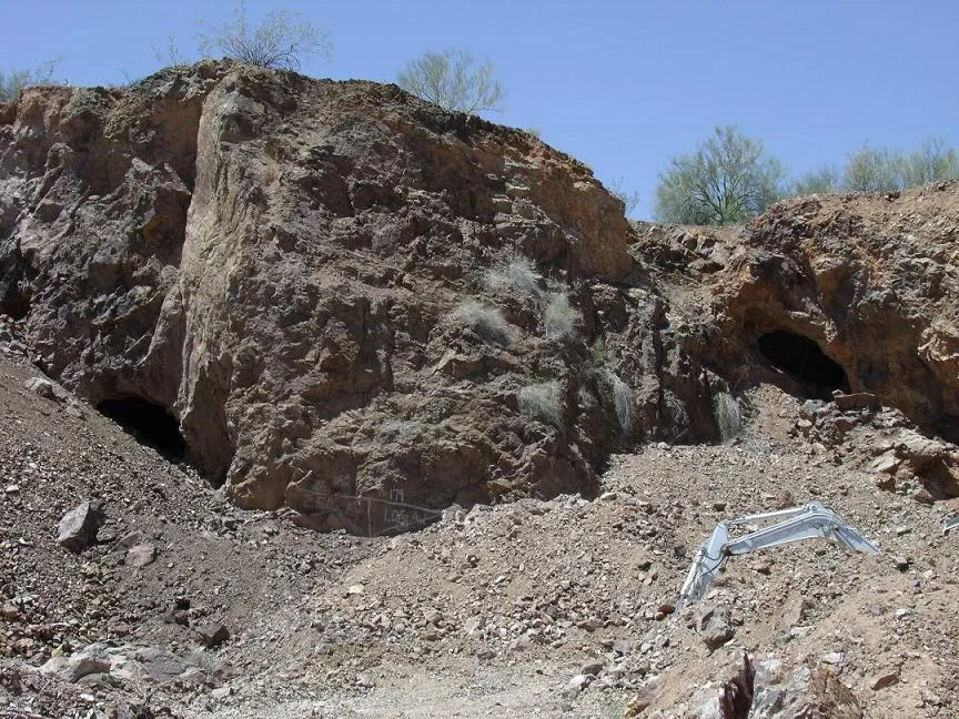 In 1863, after Henry Wickenburg discovered the Vulture Mine, Vulture City a small mining town was established in the area. The town once had a population of 5,000 citizens After the mine closed the city was deserted and became a “ghost town”. The mine and the ghost town are now a tourist attraction in Wickenberg, Arizona. The image is of the Vulture Mine and Vulture Mountain and caves.