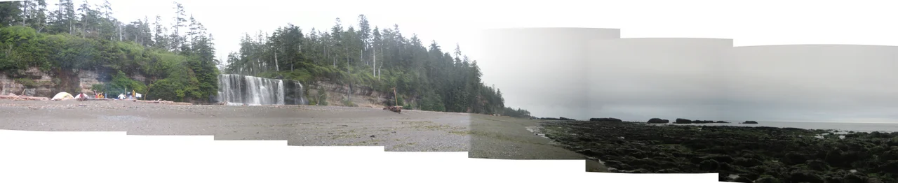 A panorama of the Tsusiat Falls campground on the West Coast Trail, tide out, on an overcast day in August 2007.  Pics taken and stitched together by me (Burtonpe).