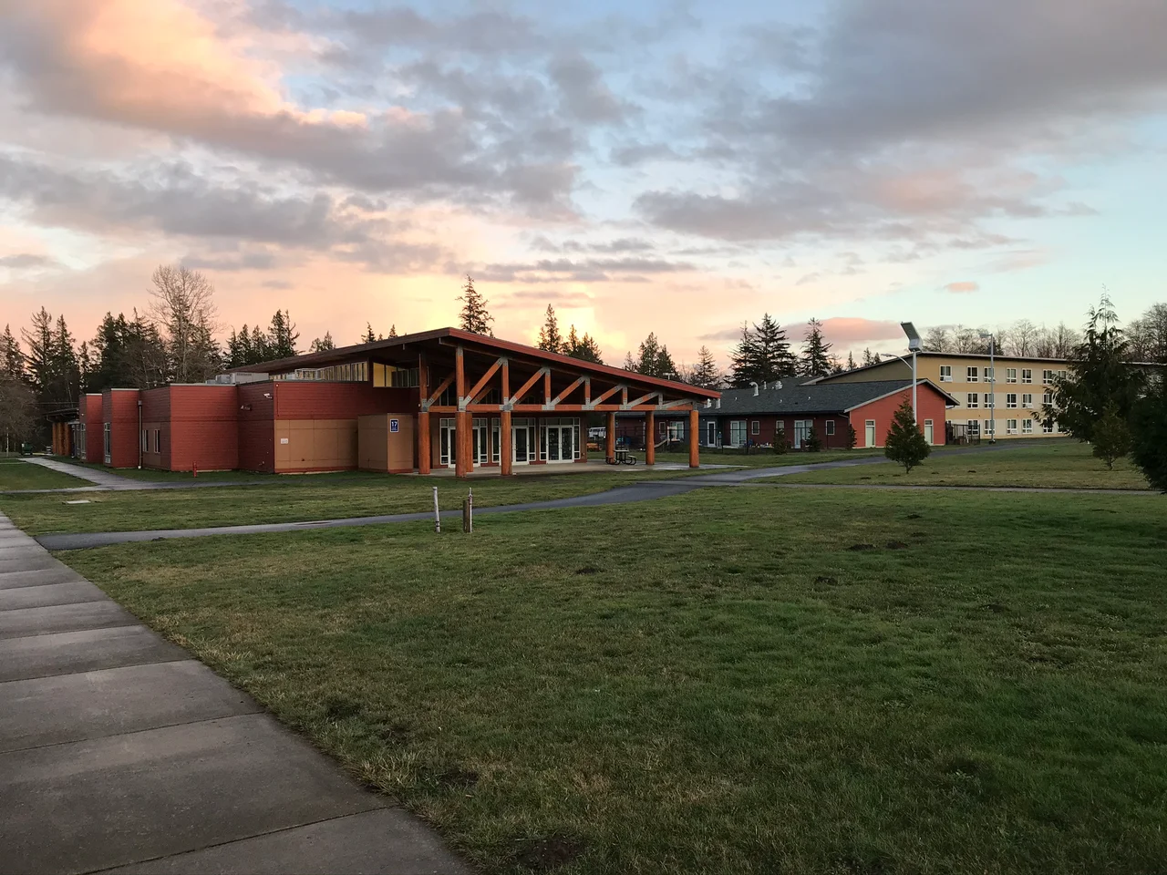 Buildings on the south campus of Northwest Indian College in Bellingham, Washington. From left to right: Center for Student Success, Early Childhood Learning Center, Student Housing/Dining Hall.