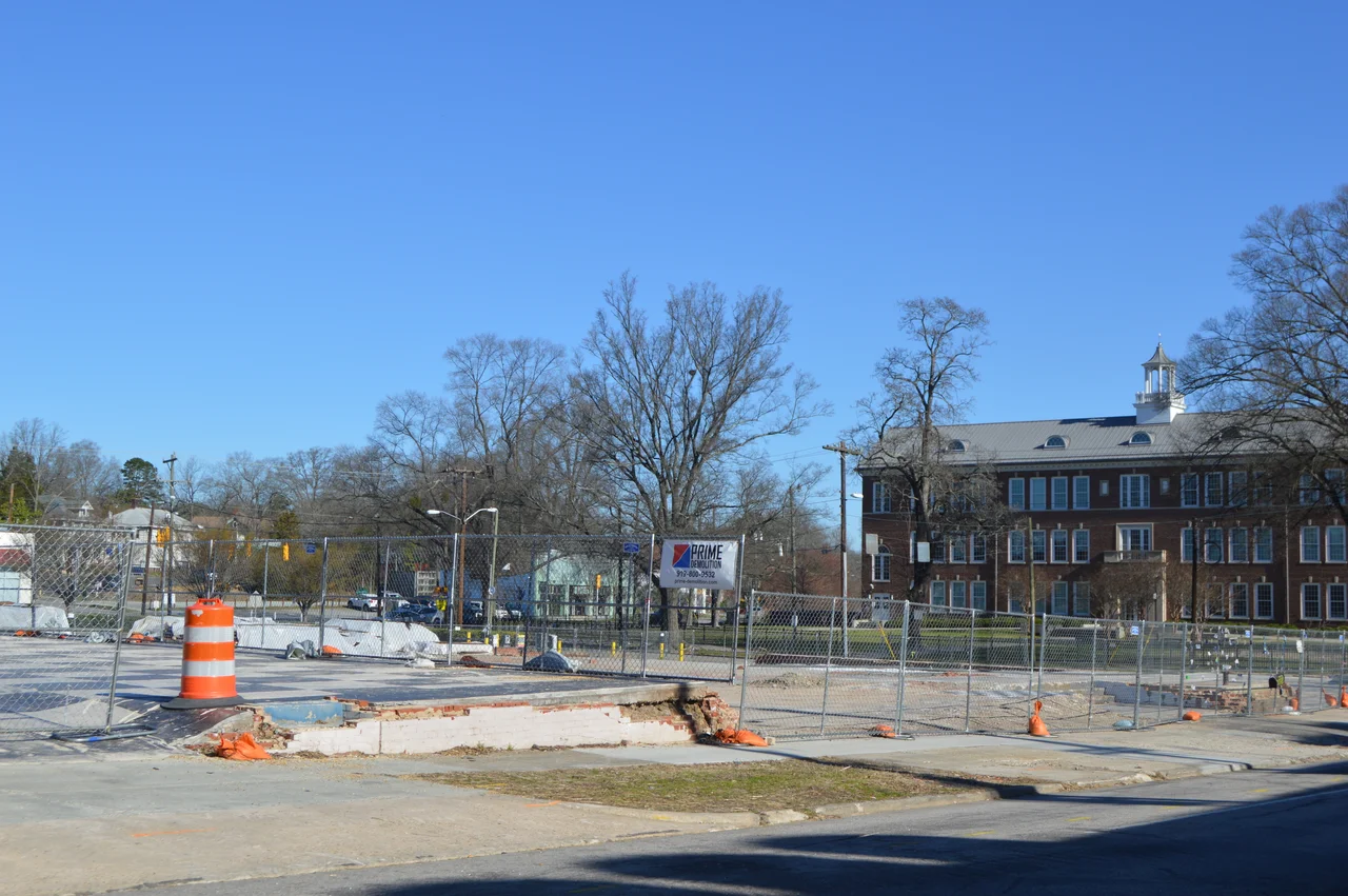 Western side of Duke Street, just south of Morgan Street, in Durham, North Carolina, United States.  Until a large gas-line explosion eleven months before this picture was taken, the fenced areas were occupied by a collection of commercial buildings.