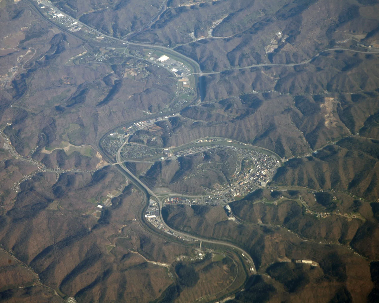 An aerial view of Pikeville, Kentucky. Downtown Pikeville and the cut through are at center.