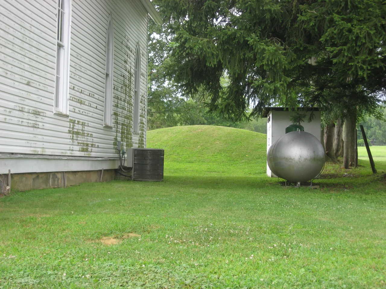Eastern side of the Zaleski Methodist Church Mound, located at 114 Broadway Street in Zaleski, Ohio, United States. Built by the prehistoric Adena culture, it is listed on the National Register of Historic Places.