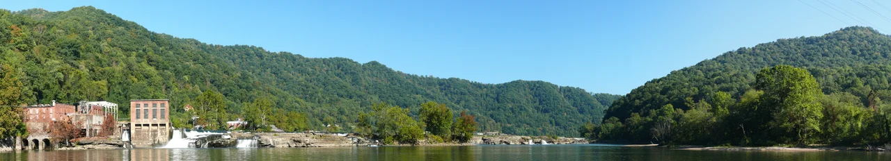 A panoramic photograph of Kanawha Falls on the Kanawha River, just downstream from the river's origin at Gauley Bridge in Fayette County, WV. Image compiled with Autostitch from 12 individual photographs, taken with a Panasonic Lumix DMC-FZ50 mounted to a Panosaurus tripod head.